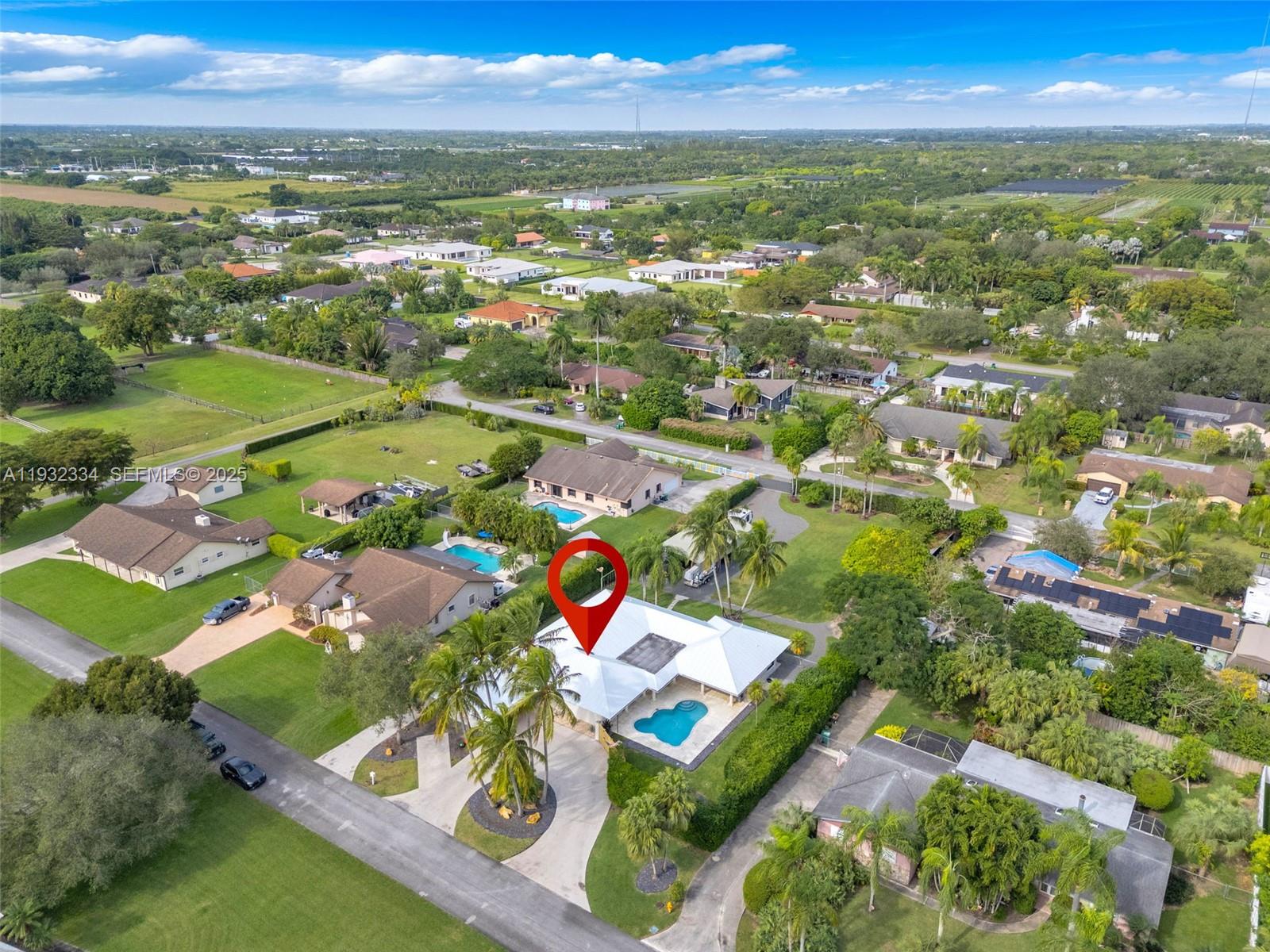 Custom-Built, Fully Updated Home featuring a split-plan layout with 4 bedrooms and 3 bathrooms, a heated pool, and a spacious covered patio with high-end finishes—ideal for entertaining. The chef's kitchen is equipped with Viking and Thermador appliances, a large pantry, and thoughtfully designed custom cabinetry and custom closets. . Bathrooms offer sleek, modern designs with beautiful finishes throughout. Pocket sliding glass doors seamlessly open to the outdoors, allowing abundant natural light to fill the home. Additional highlights include a metal roof, impact windows with accordion shutters for added protection and peace of mind, and exceptional craftsmanship throughout. There are simply too many details to list. Easy to show schedule your private tour today! The adjacent back lot is available for purchase, offering expandable space and future potential (not included in this listing). Property Located in Homestead, Florida