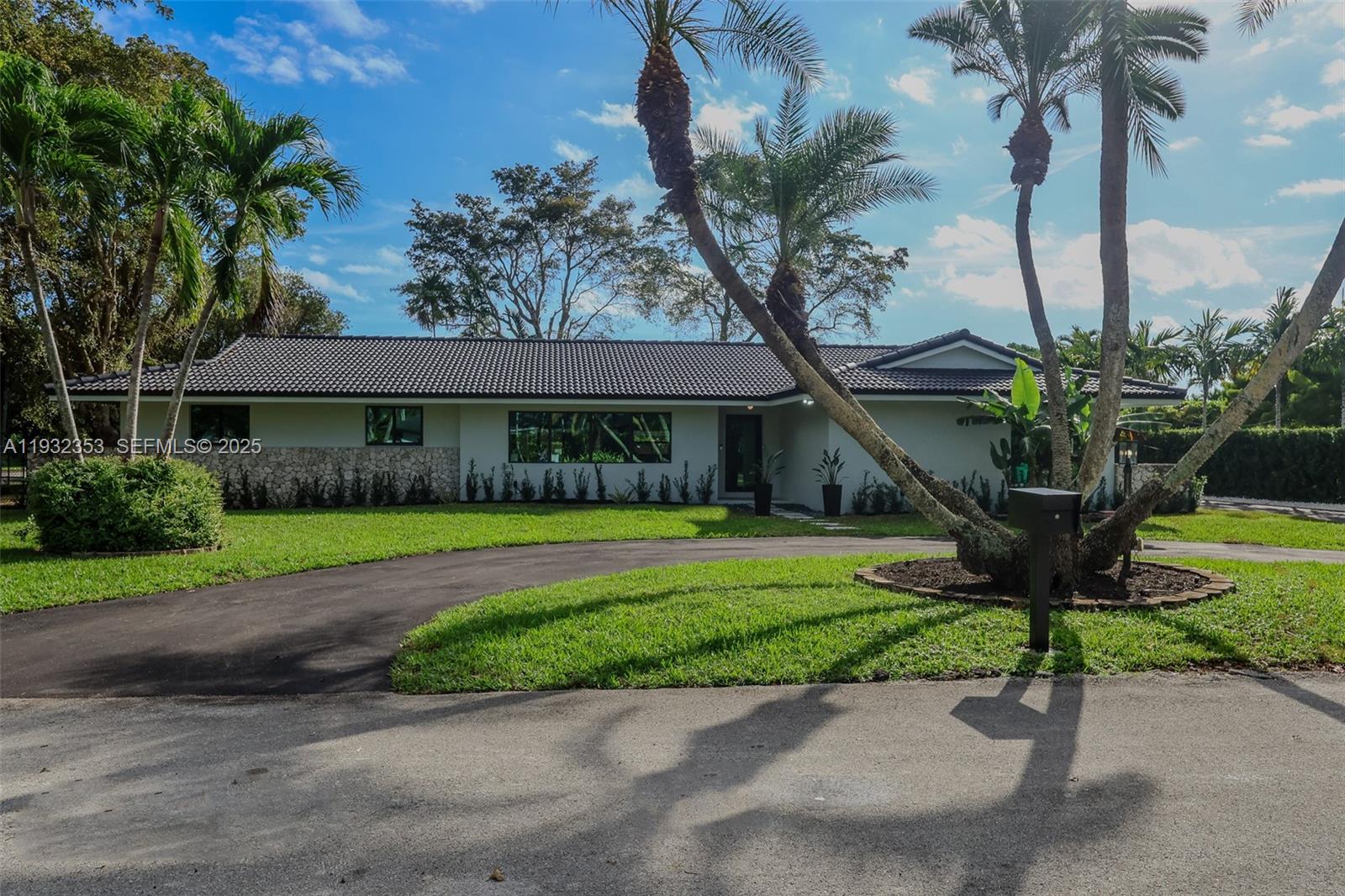 Fully remodeled home in a prime Palmetto Bay location, offering 2,961 sq ft of living area on an expansive 16,440 sq ft corner lot in a quiet cul-de-sac near Deering Estate and steps from the bay. This move-in ready residence features 5 bedrooms and 3.5 bathrooms with a split floor plan, including a second primary suite ideal for multigenerational living.Enjoy a brand-new kitchen, fully updated bathrooms, new finishes throughout, and new landscaping. Open living and dining areas flow to the pool and outdoor patio, perfect for entertaining. Ample space for boat or RV, plus a large laundry room, impact windows, and new PVC plumbing.