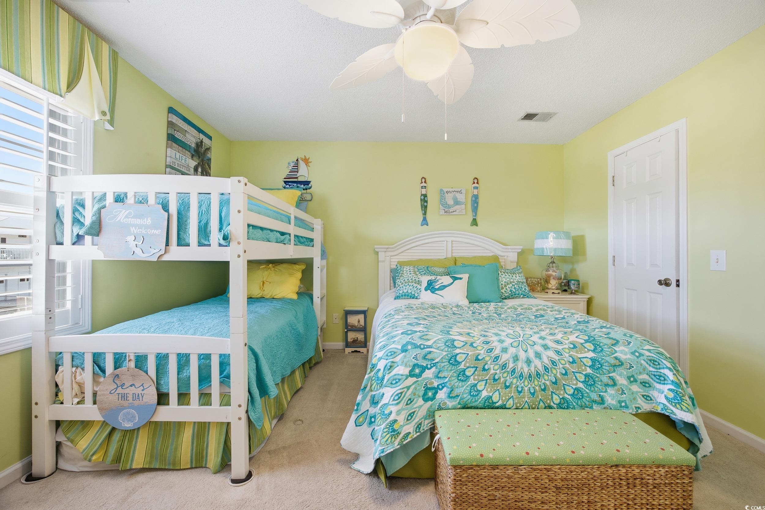 Bedroom featuring carpet flooring and a ceiling fan