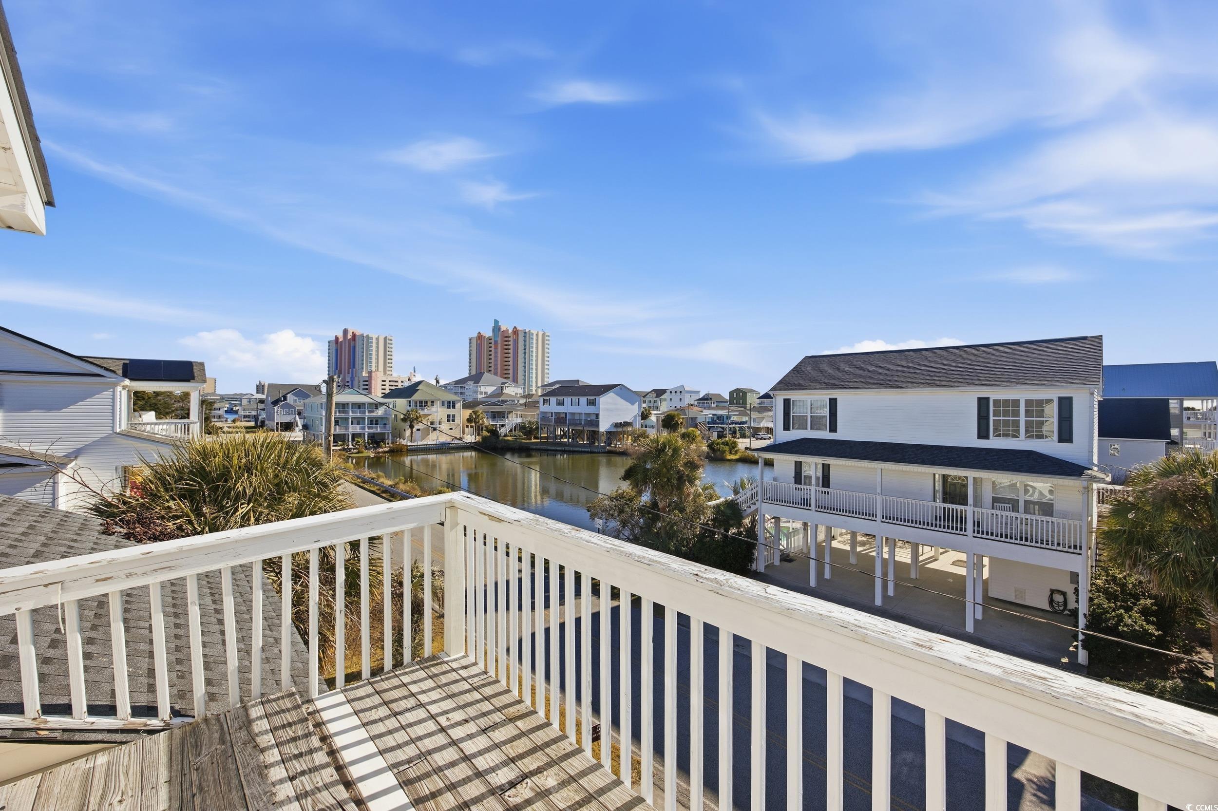 Balcony with a water view and a residential view