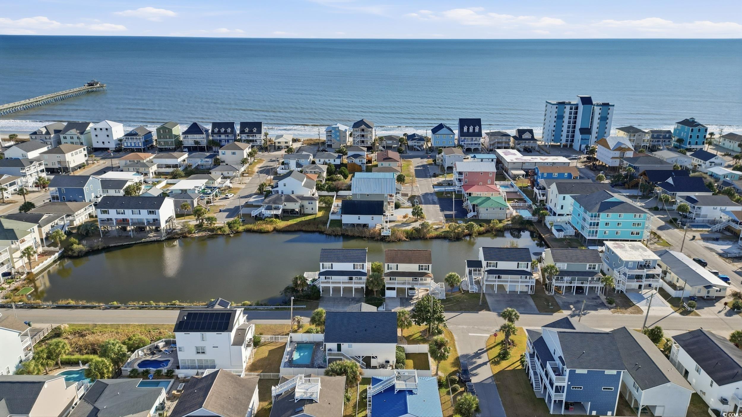 Aerial view of residential area with a large body of water
