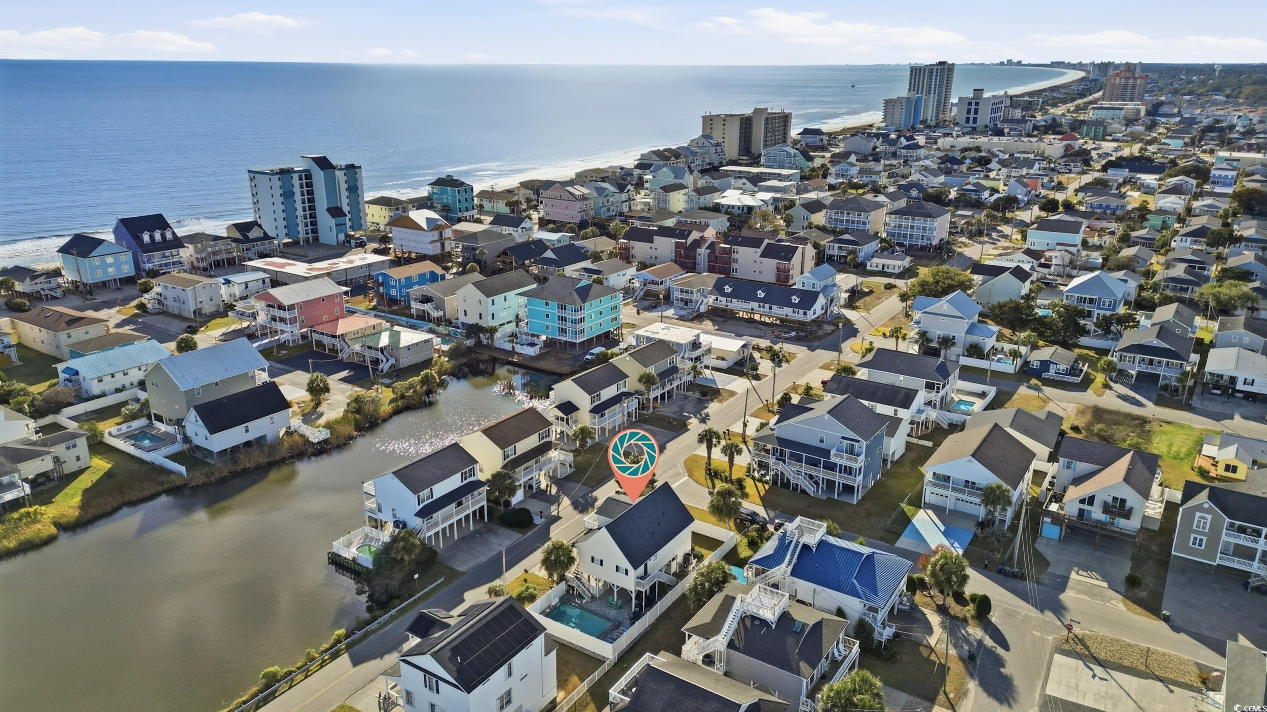 Aerial view of residential area with a nearby body of water