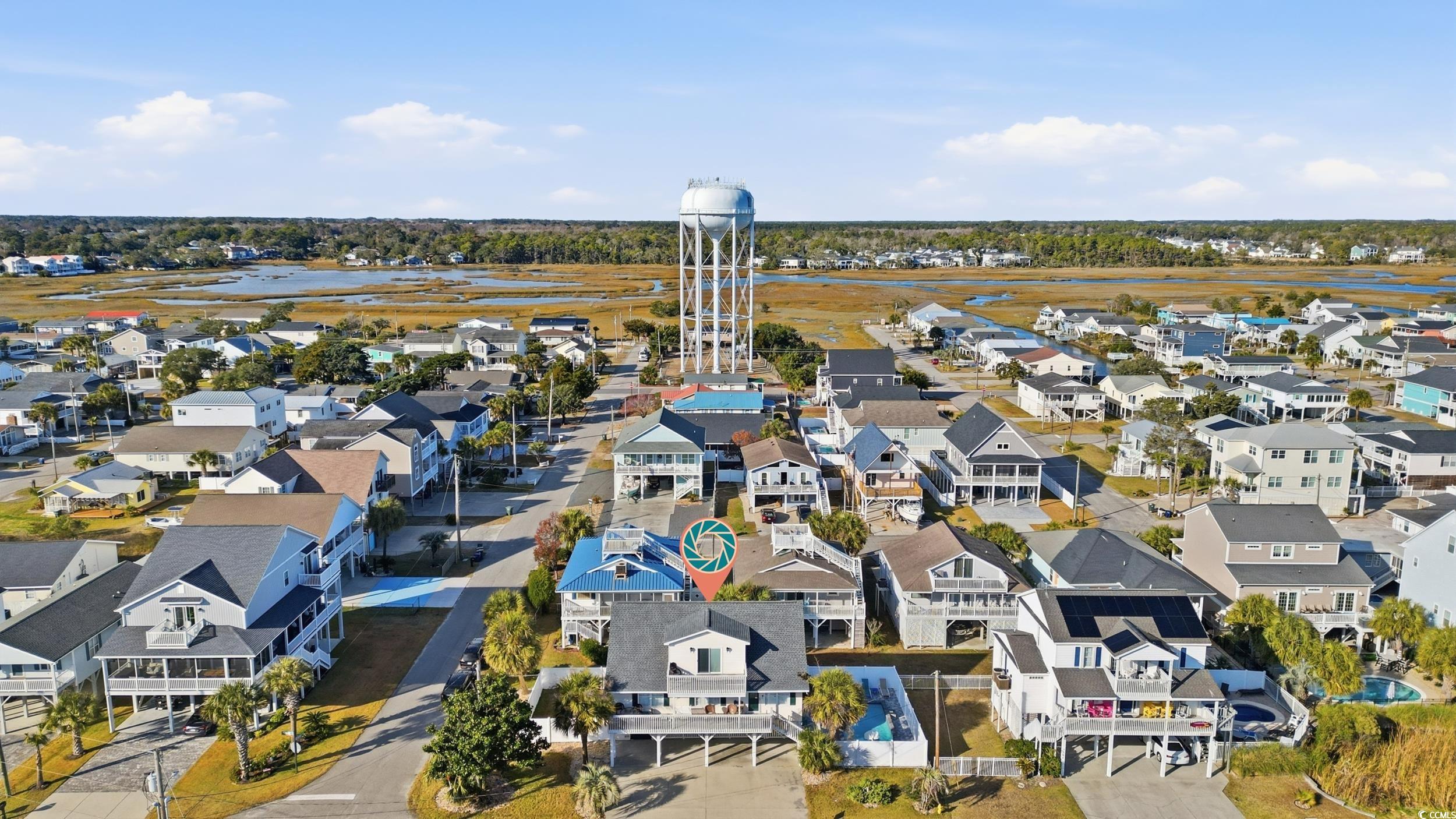 Aerial perspective of suburban area with a large body of water