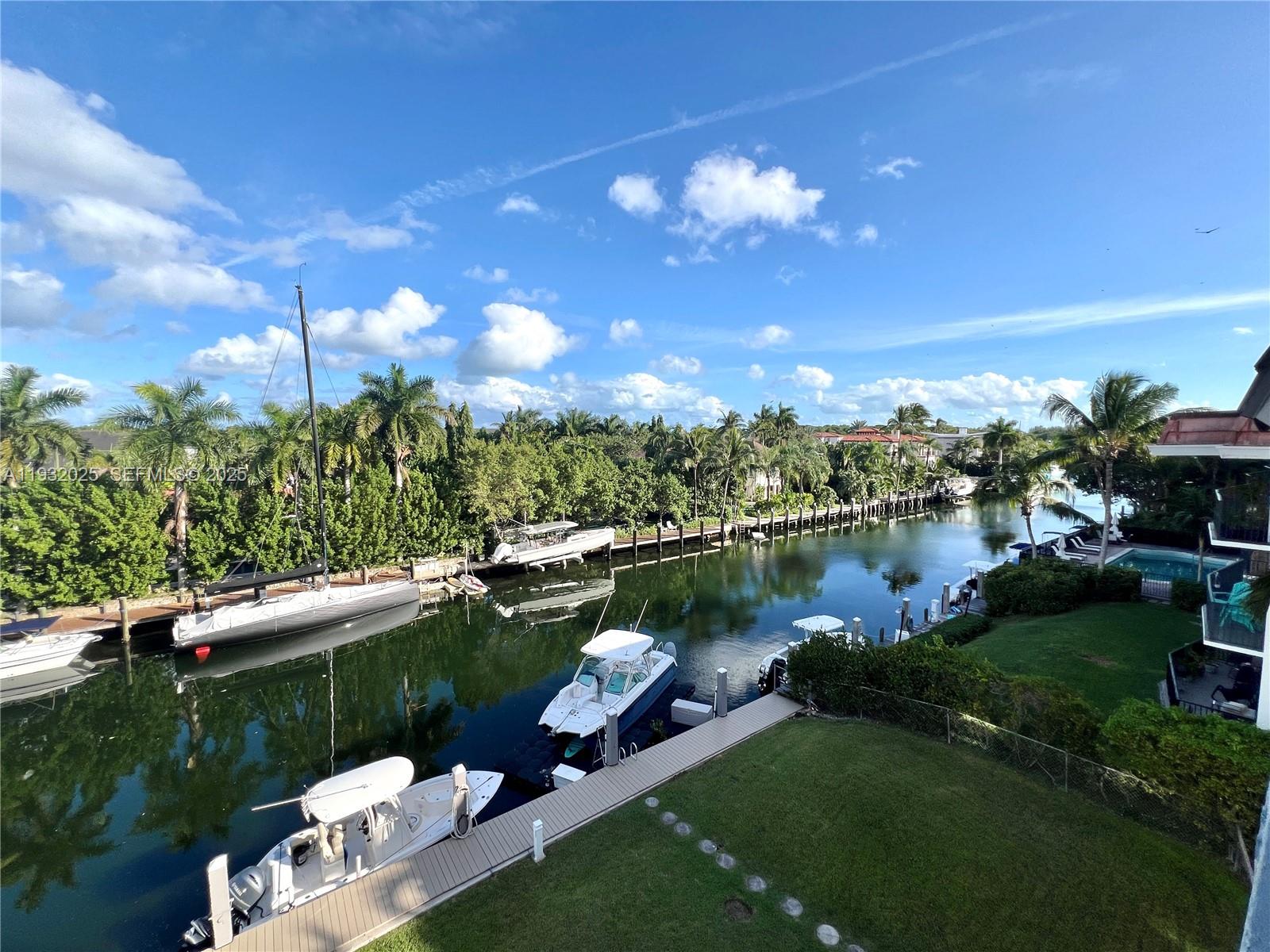 Exceptional opportunity to reside in a spacious and fully renovated 2/2 waterfront condominium in Coral Gables. The unit boasts modern amenities, including marble countertops, Thermador appliances, and a Lutron dimmable lighting system throughout. Additionally, it features an in-unit washer and dryer, impact windows and doors, a spacious walk-in closet, and a covered parking spot. Step onto the expansive balcony to enjoy breathtaking views of the water. The unit offers direct ocean access, making it an ideal choice for water enthusiasts. Engage in kayaking, paddle boarding, or simply relax by the dock and venture into the bay. The building is situated on the desirable Edgewater Drive, conveniently located just minutes from Coconut Grove, Brickell, and Coral Gables. This waterfront residence in Coral Gables presents an exclusive opportunity to make it yours and be the first occupant of this stunning unit.