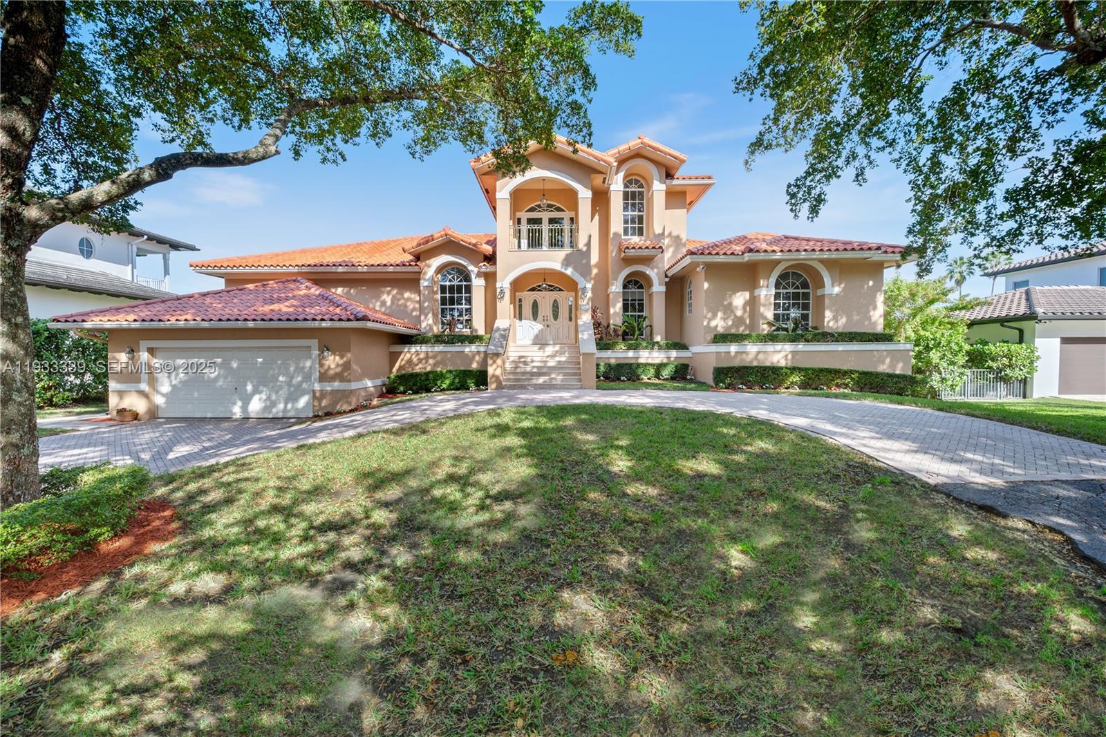 Stately and impressive executive residence set on an expansive 12,000 SF canal-front lot with a tranquil, picturesque backdrop. The elegant interior showcases soaring volume ceilings and exquisite marble and wood flooring throughout. Gracious formal living and dining rooms flow seamlessly into a stunning open family room, complemented by a gourmet kitchen and breakfast area—ideal for both everyday living and entertaining.The expansive first-floor primary suite offers a private retreat, while all bedrooms enjoy beautiful water or garden vistas. Outdoors, an inviting open pool and newly rebuilt seawall (completed approximately three years ago) enhance the serene waterfront setting.Designed for refined family living and grand-scale entertaining, this exceptional estate offers approximately 4,788 square feet of thoughtfully curated luxury. Ideally located within walking distance to the community park and Gulliver School, and surrounded by top-tier public and private schools. Minutes from Deering Bay Yacht & Country Club, as well as Chapman and Fairchild Tropical Gardens. Please refer to Broker Remarks for showing instructions.