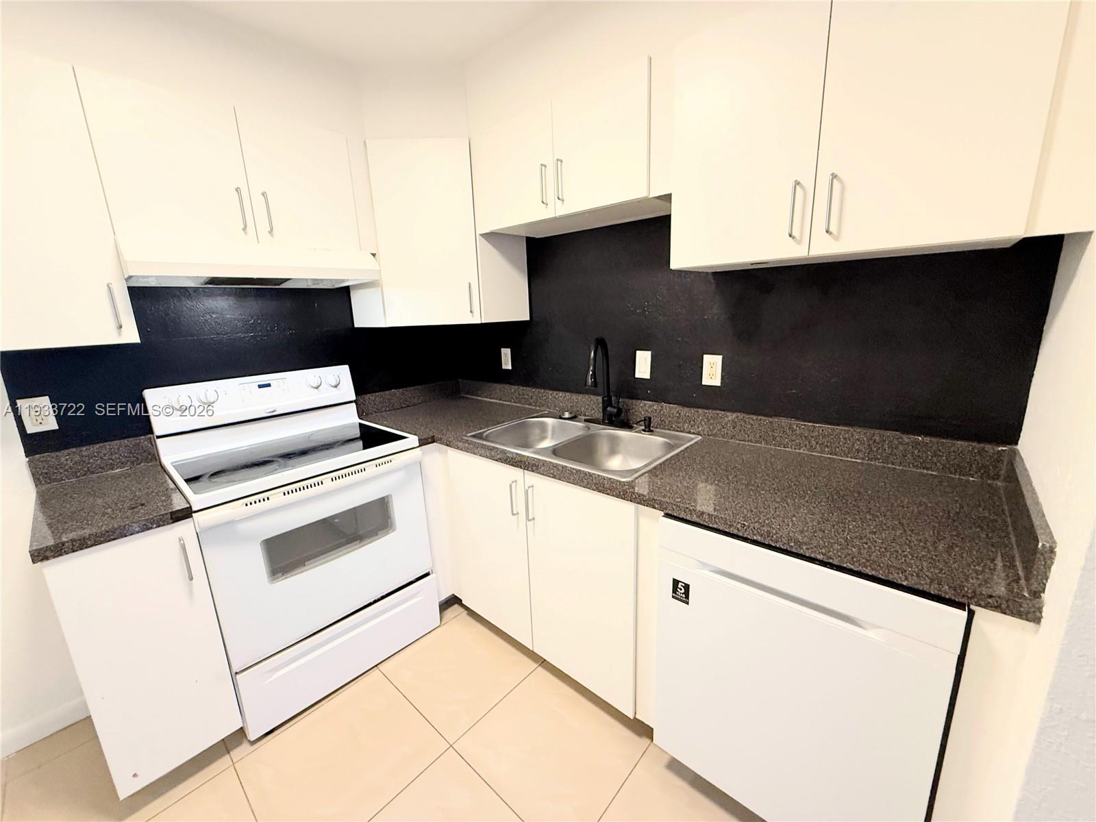 Modern kitchen with designer features at 2950 Griffin Rd - Home in Dania Beach