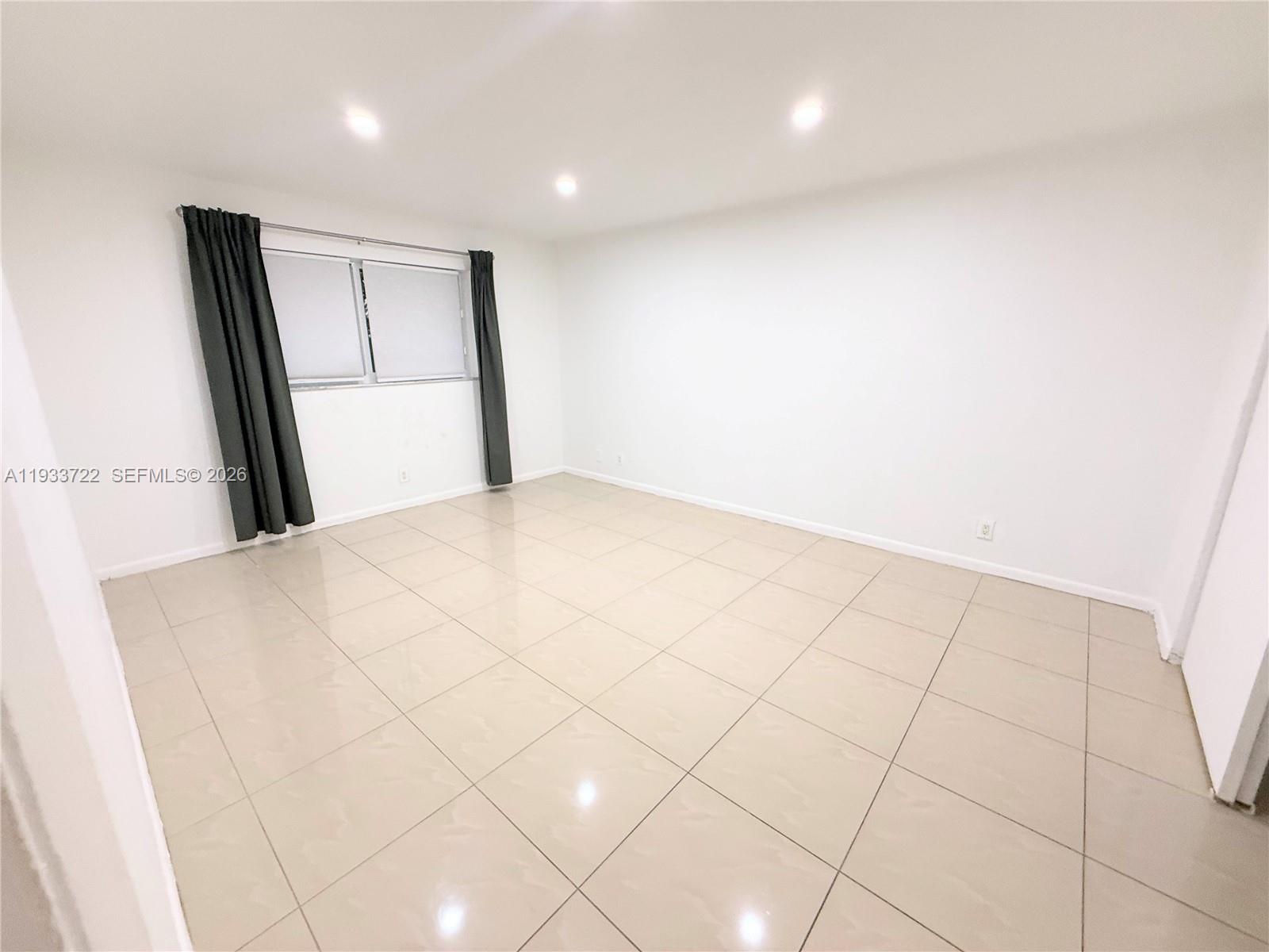 Well-appointed guest bedroom at 2950 Griffin Rd - Home in Dania Beach