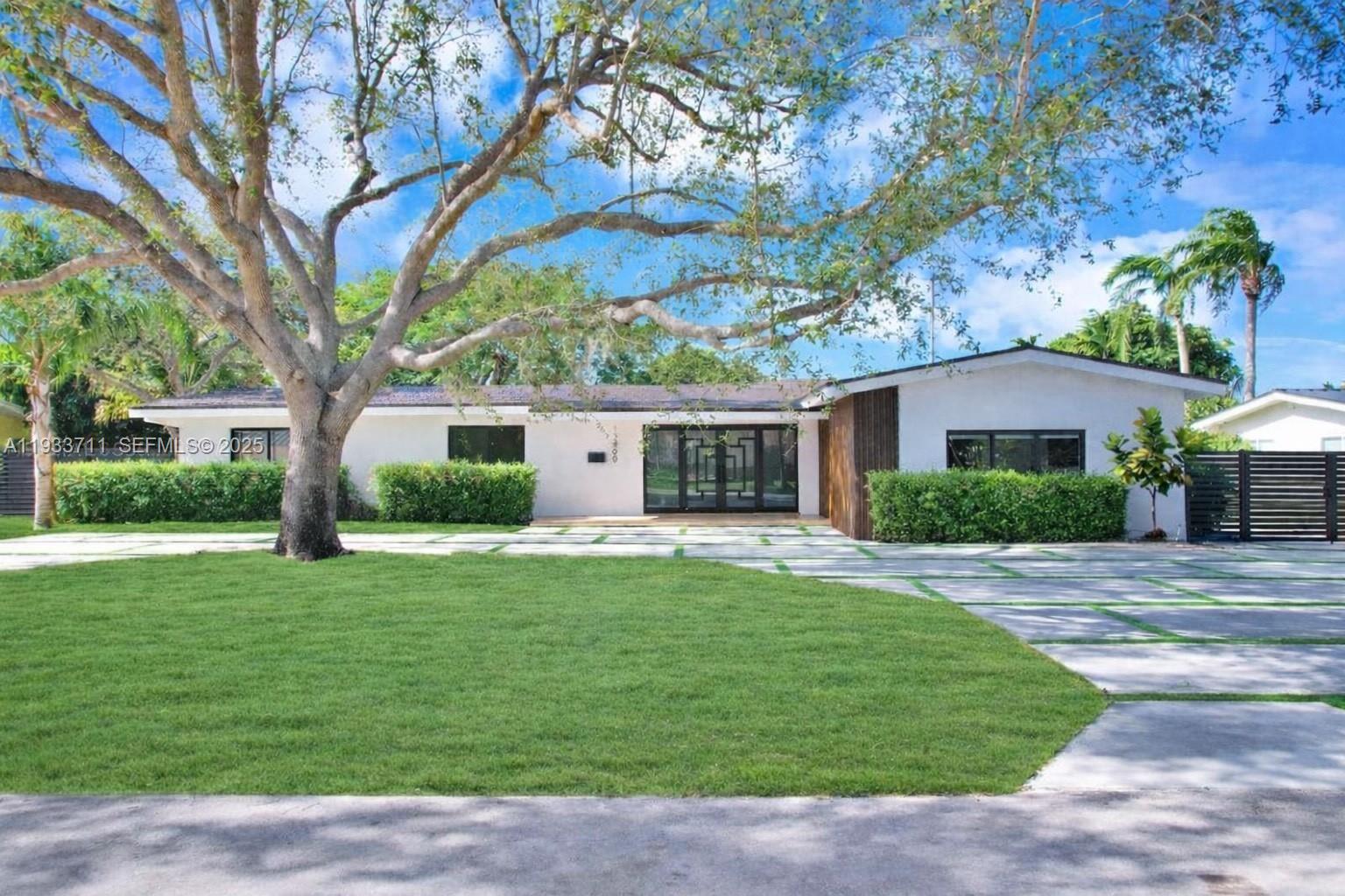 Experience luxury living in this impeccably renovated North Palmetto Bay residence, located just three blocks south of Pinecrest and within proximity to top-rated schools. This spacious home offers over 3,000 SF of living area with an open floor plan filled with natural light, two primary-sized suites, and ensuite bathrooms in every room. The grand foyer provides a direct view of the pool and expansive yard, perfect for entertaining. Worry free living with impact windows and doors, PVC plumbing, two new A/Cs, brand new driveway/travertine pavers, and all new appliances. Don’t miss this rare opportunity to live in the middle of two of Miami’s best neighborhoods with a completely updated home—schedule your private showing today! Home is 3,060 sq ft under air per appraiser.