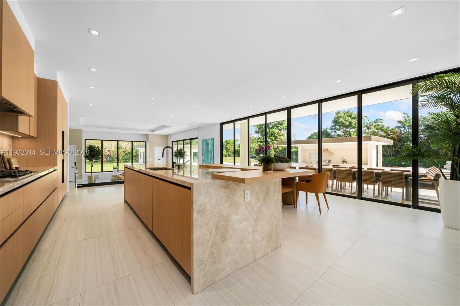 Modern kitchen with designer features at 17841 70th Pl - Luxury Estate in Southwest Ranches