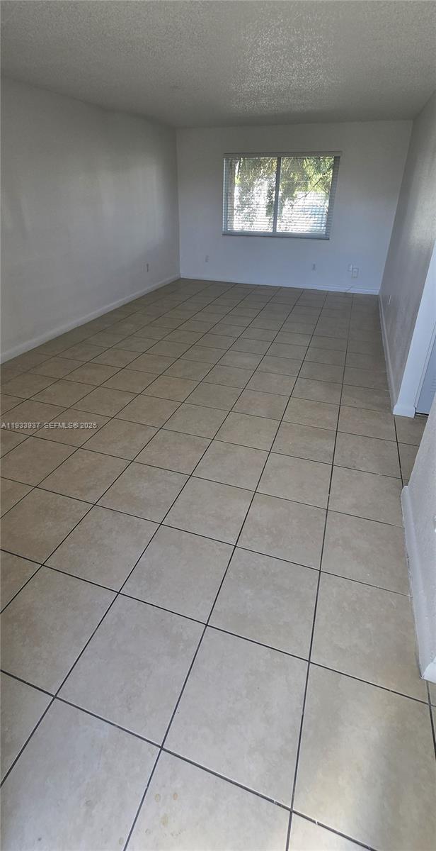 Spacious and well-maintained 1-bedroom, 1-bathroom apartment located on the 3th floor with elevator access, situated in a secure, gated community with 24-hour security. Rent includes water and high-speed Internet/Wi-Fi. The unit offers a comfortable layout with abundant natural light, two unassigned parking permits, and access to a community pool and on-site laundry facilities. Conveniently located near Florida Turnpike Exits 12 and 13. Fast and easy approval process.