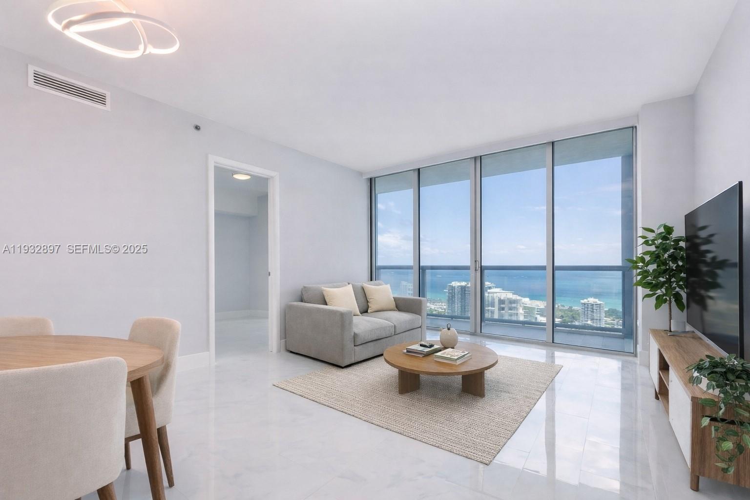 One or more photo(s) was virtually staged. High floor 2-bedroom, 2-bath residence at Icon Brickell Tower I featuring an open layout, floor-to-ceiling glass, and a private balcony with bay views. Electronic shades in blackout channels.  The split bedroom layout provides privacy and functionality for everyday living. Icon Brickell is a full-service waterfront community with resort-style amenities including multiple pools, a state-of-the-art fitness center, spa, 12-hour valet, concierge, and on-site dining. Ideally located along the Miami River with direct access to the Riverwalk and just minutes from Brickell City Centre, Mary Brickell Village, and Downtown Miami, offering excellent walkability. Leasing is permitted twice per year with a minimum lease term of 6 months + 1 day. Centrally located with easy access to major highways and Miami Beach.