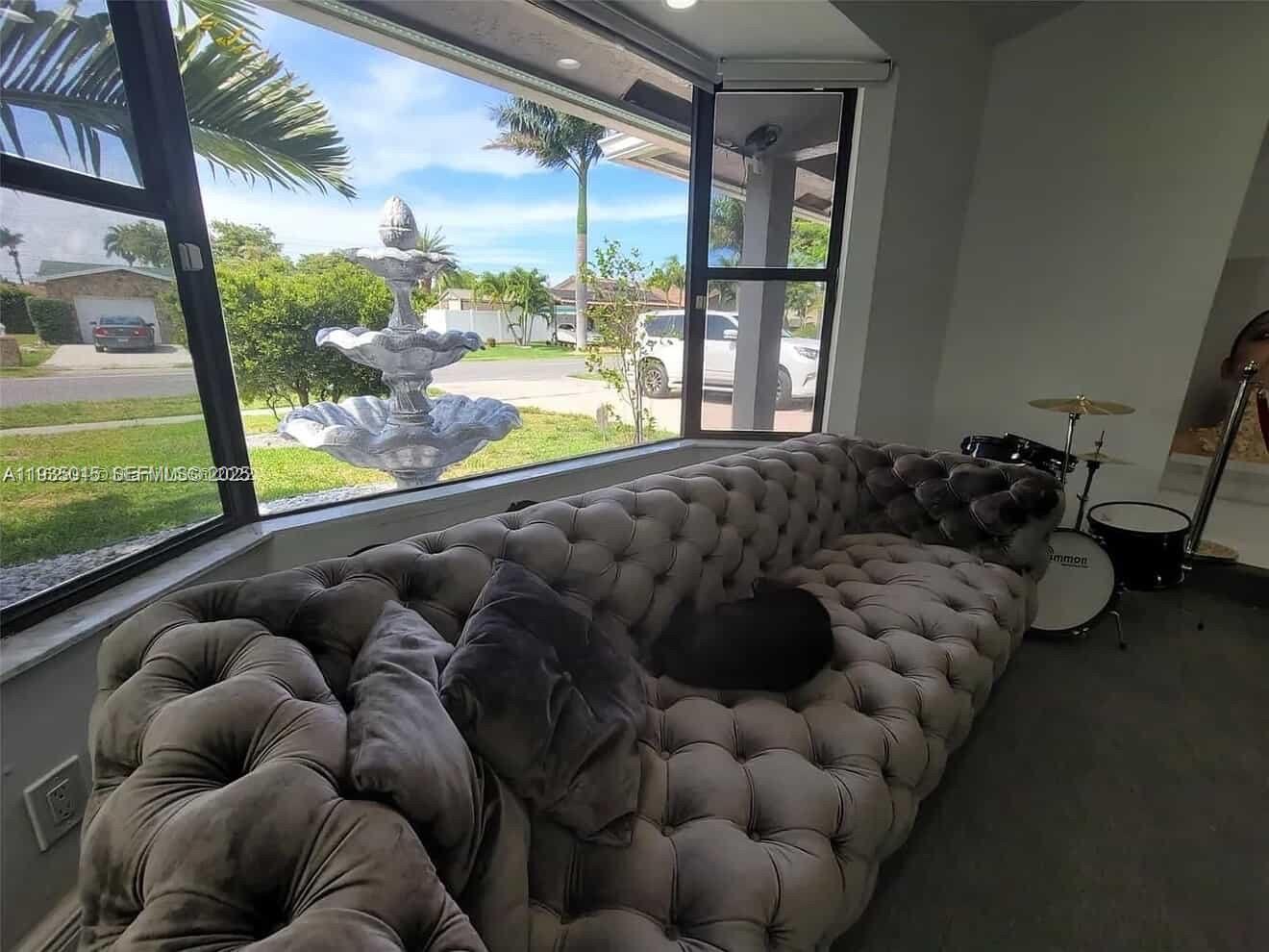 Open-concept living area at 270 7th St - Home in Dania Beach