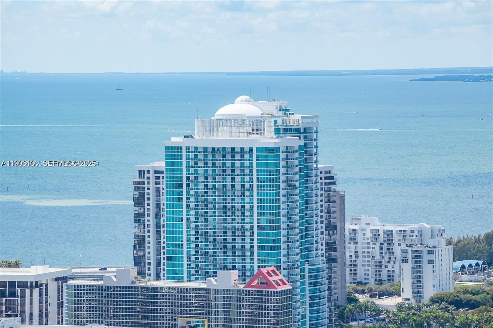 PURE LUXURY! Soaring from the 44th floor, this renovated 2BR/2.5BA corner residence offers panoramic Bay and Miami skyline views through floor-to-ceiling windows. The modern open layout features a sleek updated kitchen, wood floors in both bedrooms, and stylishly redesigned bathrooms with designer finishes. Enjoy a bright, airy living space that flows to a private balcony overlooking the city and water. Both bedrooms include ensuite baths and generous closets. Renovated less than 2 years ago, this turnkey, move-in-ready home sits in a full-service, resort-style building with a pool, fitness center, valet, and 24-hr concierge. Prime Brickell location steps to Brickell City Centre, dining, shops, and nightlife. Flexible 30-day rental policy (12x/year)—ideal for end-users or investors seeking strong rental potential. **Seller motivated and may contribute to the buyer's closing costs!**