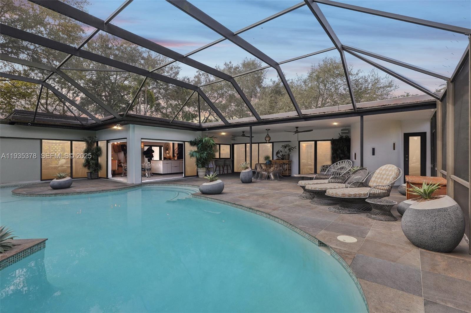 Stunning 3BR/2BA home in highly sought-after Cutler Bay. The living room boasts wood-beamed ceilings and a cozy fireplace, creating a warm, inviting space.The open-concept design connects living, dining, and kitchen areas. The gourmet kitchen features sleek countertops, modern cabinetry, and stainless steel appliances, while the dining area overlooks the private backyard and sparkling pool. Retreat to spacious bedrooms, including a luxurious primary suite with direct access to the outdoor oasis.The backyard is an entertainer’s paradise with a screened-in pool, patio area, and lush tropical landscaping. Additional highlights include impact-resistant windows and doors, a spacious garage, and room for RV or boat parking.Close to schools, shopping, and major highways, this home blends modern elegance with Florida’s relaxed lifestyle—offering the perfect balance of indoor luxury and outdoor serenity.