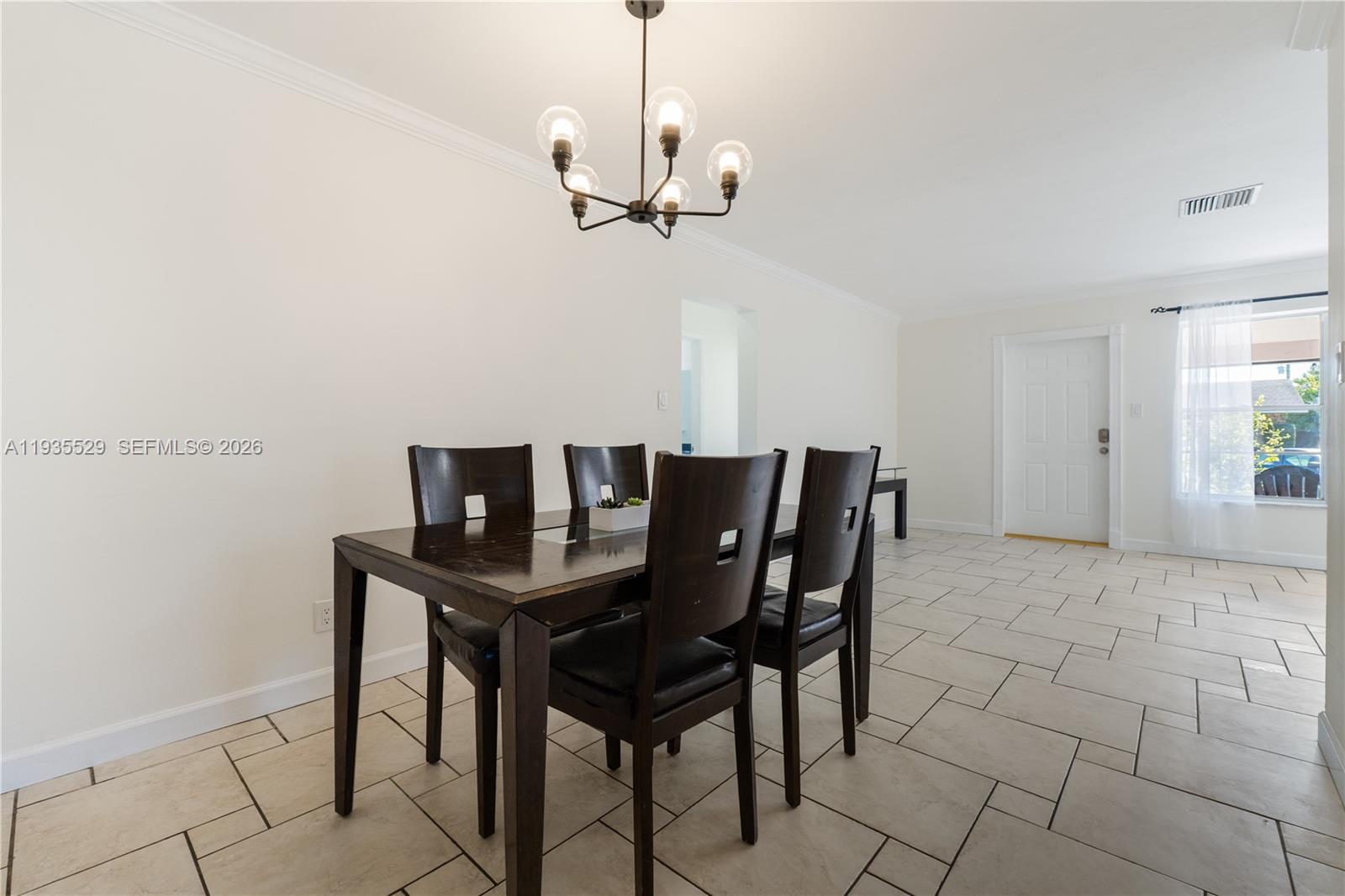 Modern kitchen with designer features at 232 6th St - Home in Dania Beach