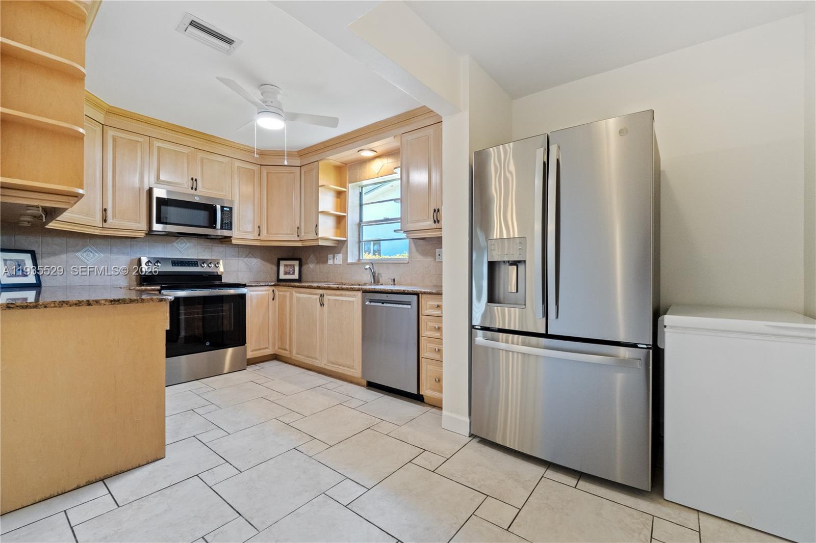 Well-appointed guest bedroom at 232 6th St - Home in Dania Beach