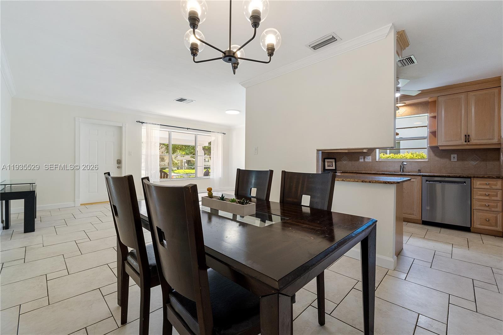 Open-concept living area at 232 6th St - Home in Dania Beach