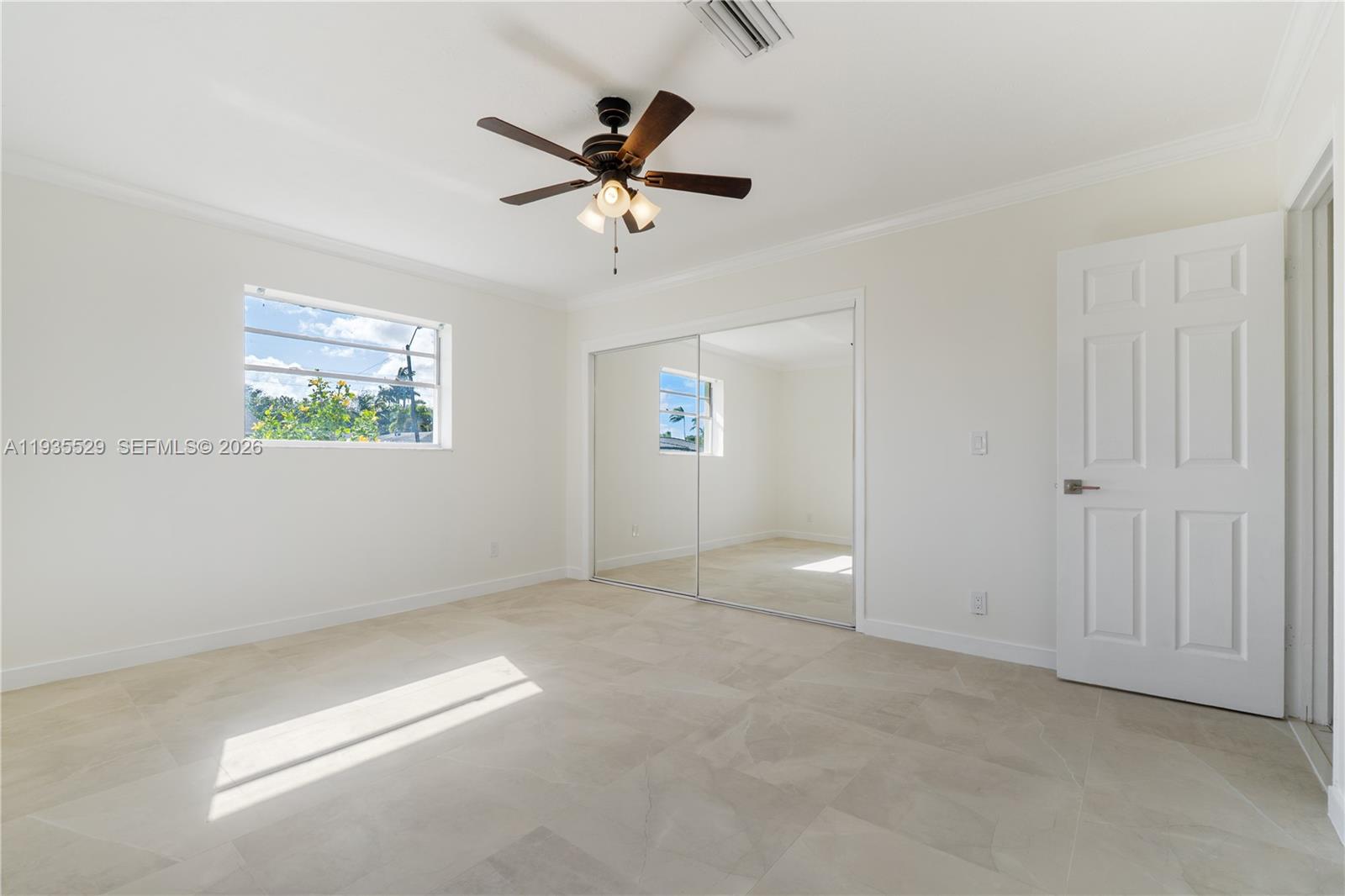 Well-appointed guest bedroom at 232 6th St - Home in Dania Beach