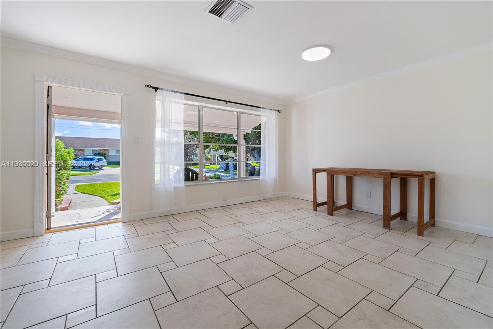 Modern kitchen with designer features at 232 6th St - Home in Dania Beach