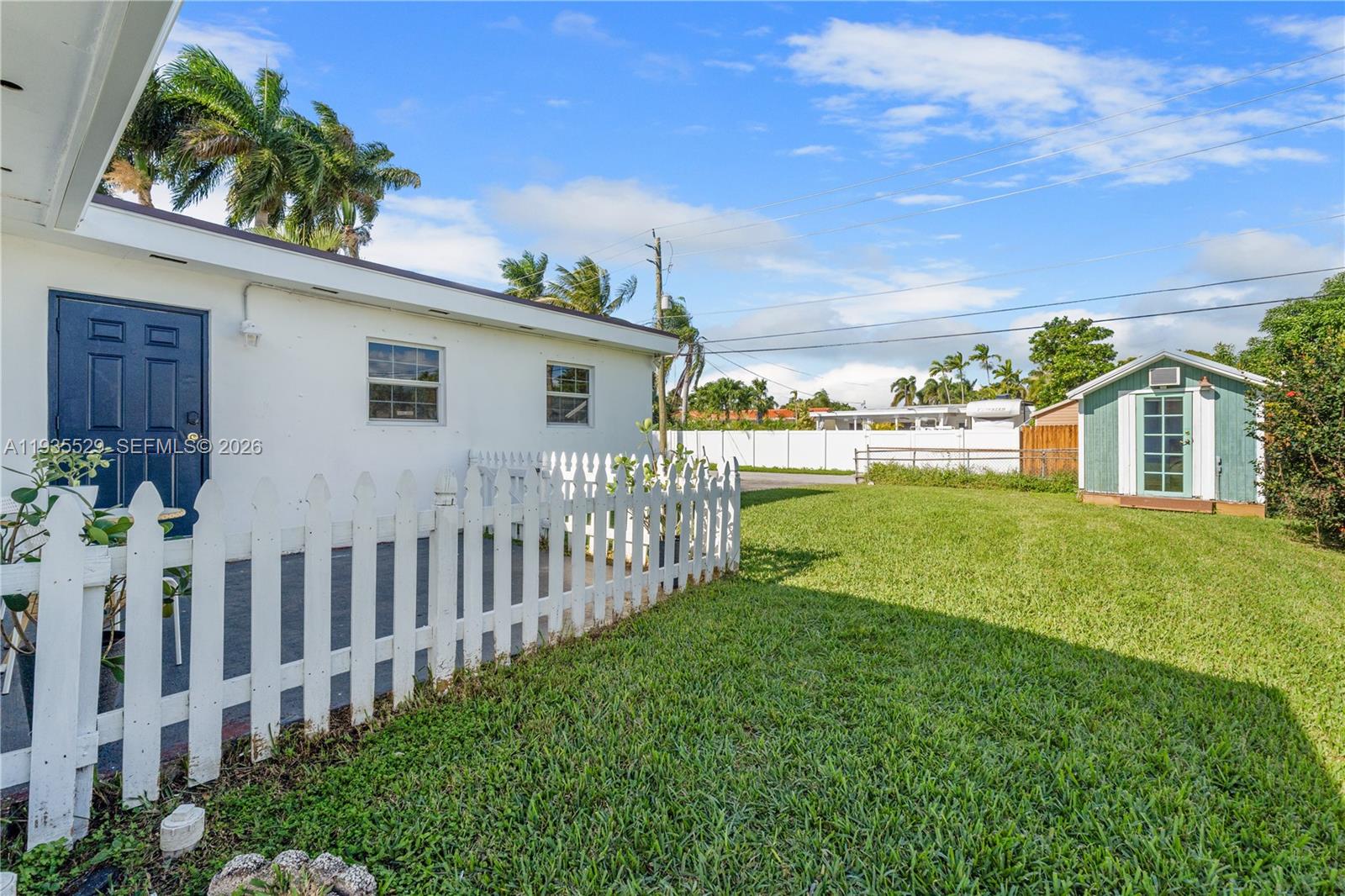 Open-concept living area at 232 6th St - Home in Dania Beach