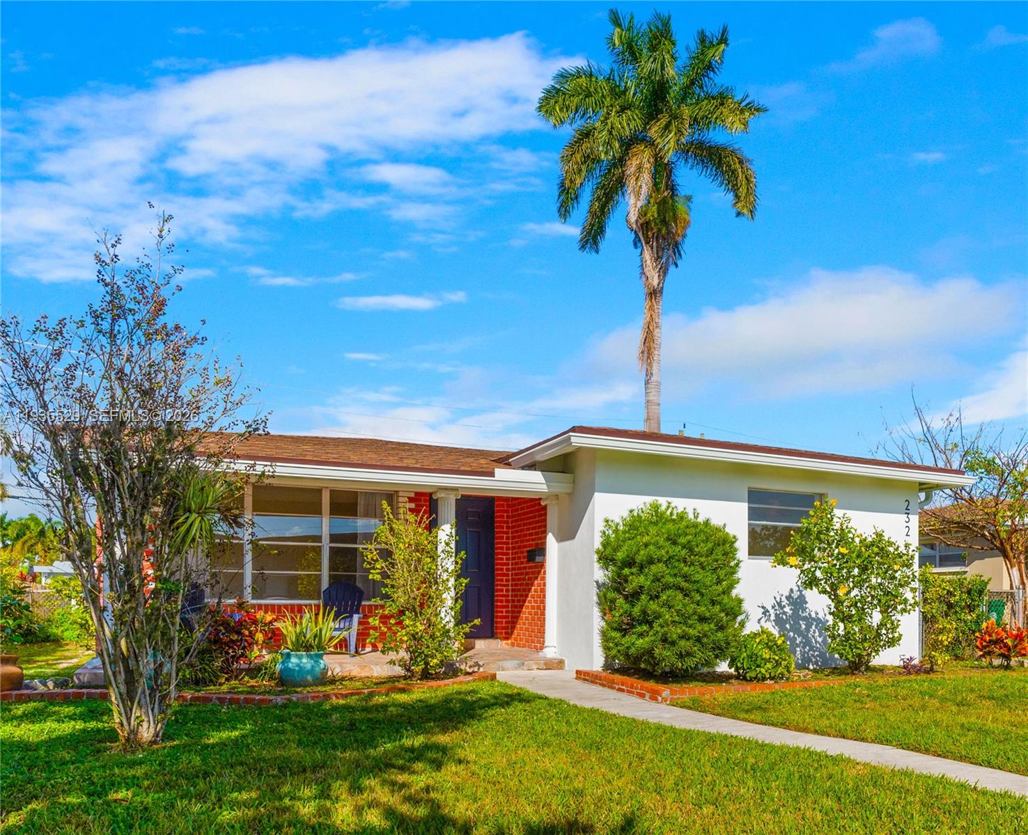 Modern kitchen with designer features at 232 6th St - Home in Dania Beach