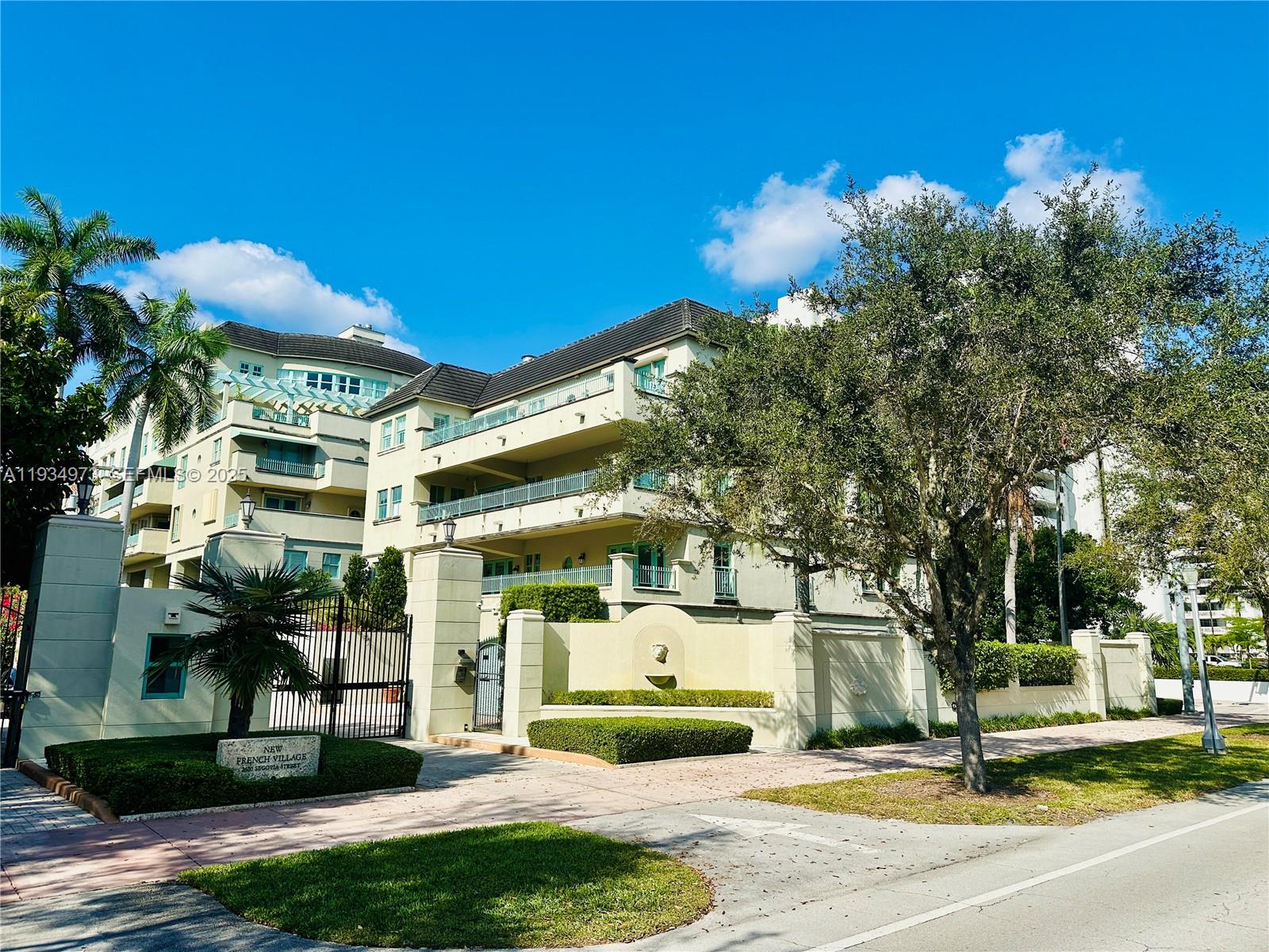 Incredibly rare and spacious corner residence in the gated New French Village community of Coral Gables. This expansive home offers a well balanced layout with generous living and dining areas, newly installed oak hardwood floors throughout main spaces, high ceilings, crown molding, and abundant natural light. The oversized living room opens to a wide covered terrace, ideal for outdoor dining or relaxed evenings overlooking the quiet interior grounds.The kitchen is thoughtfully designed with solid wood cabinetry, stone countertops, built in appliances, ample storage, and a breakfast nook that feels both functional and inviting. Multiple bedrooms are well proportioned, including a large primary suite with private access to the terrace, a spa style bathroom featuring a soaking tub, separate shower, dual vanities, and substantial walk in closets.Additional features include a private in unit elevator entry, dedicated laundry room, multiple storage areas, excellent separation between living and sleeping quarters, and a private two car garage. The residence conveys a sense of privacy rarely found in condominium living.New French Village is a well maintained, boutique style community with controlled access, lush landscaping, and a central Coral Gables location close to Miracle Mile, the Biltmore, dining, shopping, and major thoroughfares. This is a refined rental opportunity for tenants seeking space, quiet, & classic Gables architecture without sacrificing convenience.