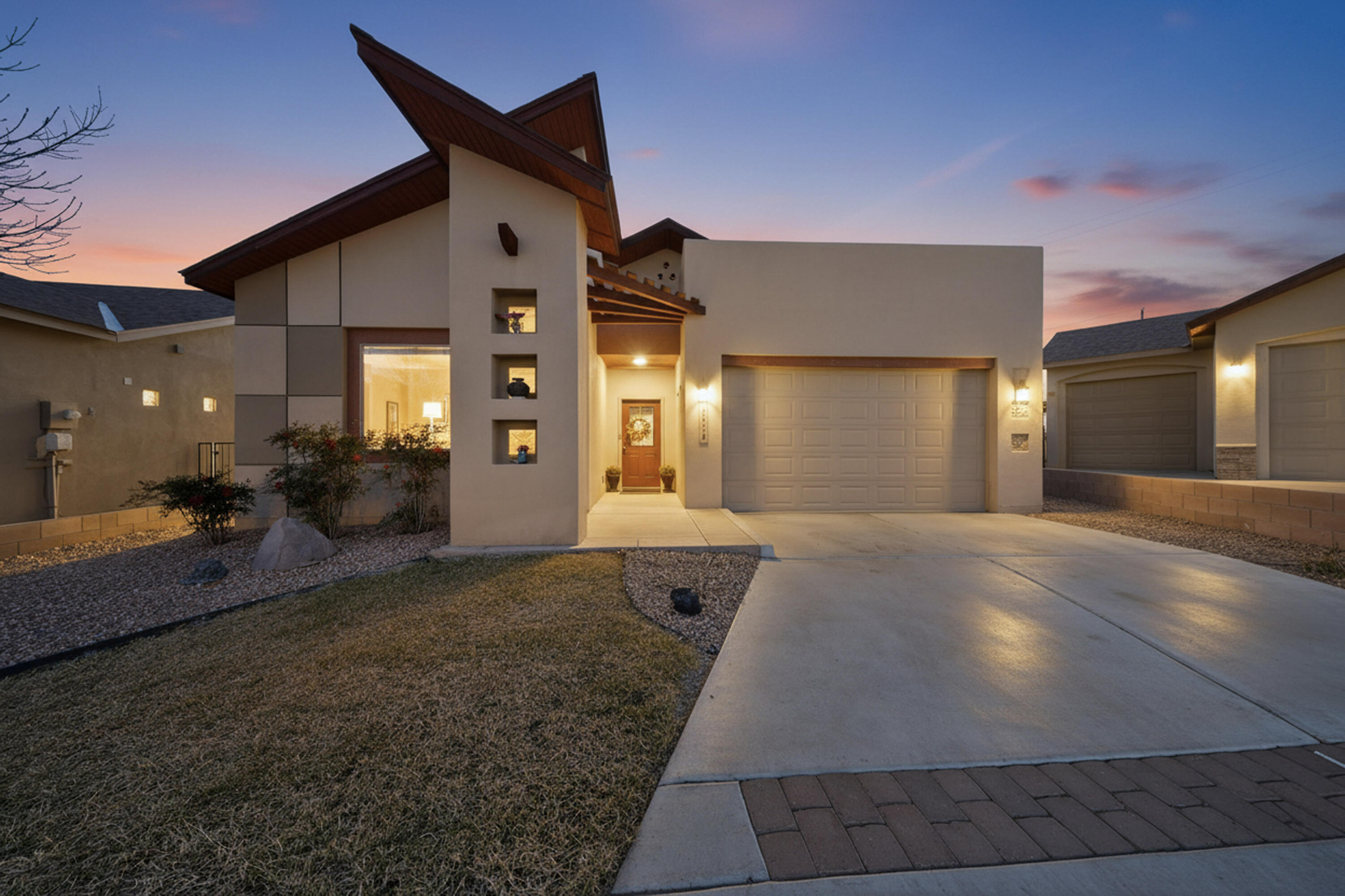 Discover sustainable luxury in this impeccably maintained Paul Allen home. Gold Standard green-built with owned solar panels. This contemporary Southwest gem features a decorative flagstone entryway leading to a bright, open-concept floor plan. The chef's kitchen boasts granite countertops, a large island, stainless appliances, and a large walk-in pantry. Retreat to the master suite, complete with dual walk-in closets and a custom spa-like shower. Modern comforts include ceiling fans throughout, high-efficiency toilets, and a full alarm system. Outside, relax on the extended patio and covered veranda overlooking a walled backyard with views of the southern open space. With xeriscaped curb appeal and a landscaped backyard, this eco-friendly oasis is move-in ready!