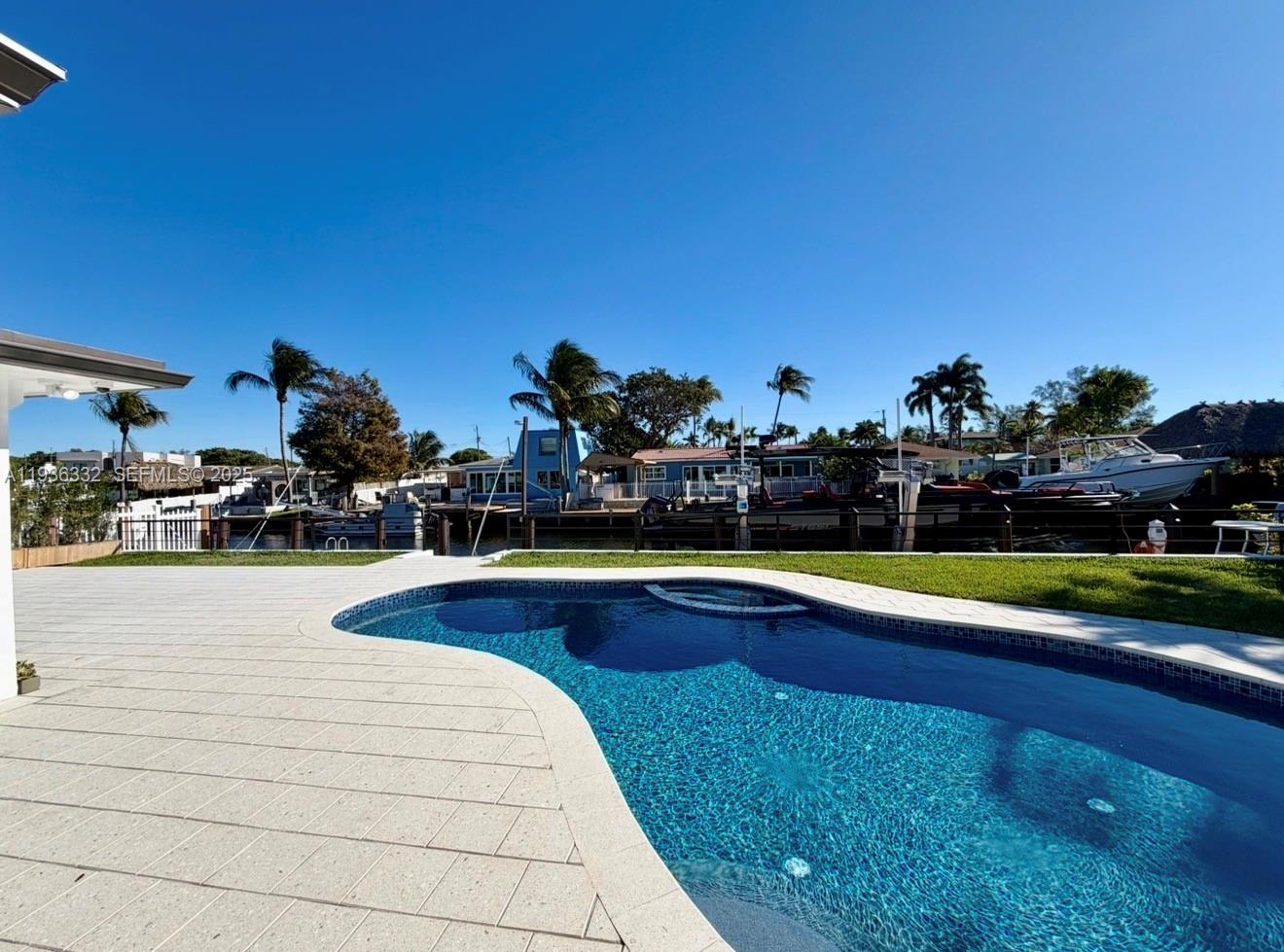 Resort-style pool and outdoor entertaining at 806 Argonaut Is - Home in Dania Beach