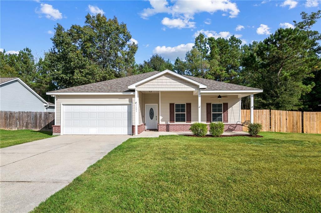 Available now: 4 bedroom home for lease in Hammond, LA at 11393 Wellington Lane! This move-in ready single-family rental provides approximately 1,995 sq ft of comfortable living space on a 0.27-acre lot in the Wellington Estates subdivision—offering convenience and room in a peaceful setting.The open floor plan connects the family room seamlessly to the efficient kitchen, ideal for daily use and staying connected while preparing meals. The kitchen includes a convenient pantry for storage, ample cabinetry, stainless steel appliances, and easy-maintenance flooring in the main areas.All four bedrooms feature brand-new flooring—completely carpet-free for a fresh, low-maintenance, and modern feel! The primary suite has a private en-suite bath, with an additional full bath serving the other bedrooms.Enjoy the front porch with its relaxing swing, or step out to the covered back deck recently updated with new wood for added durability—extending into the fenced backyard for outdoor space.Recent upgrades include a new HVAC system and water heater installed in 2025, plus a roof replaced in 2021. Additional features: central heat/air, ample parking, and a prime location near schools, shopping, dining, Southeastern Louisiana University, major highways, and Hammond amenities.Lease details: $2,100/month, 12-month term preferred, tenant responsible for electricity and water, security deposit $2,100 (subject to approval). Perfect for those seeking a turn-key Hammond LA rental, 4 bedroom 2 bath lease in Hammond, or updated single-family home in a desirable area. Contact for application/showing—availability won't last!