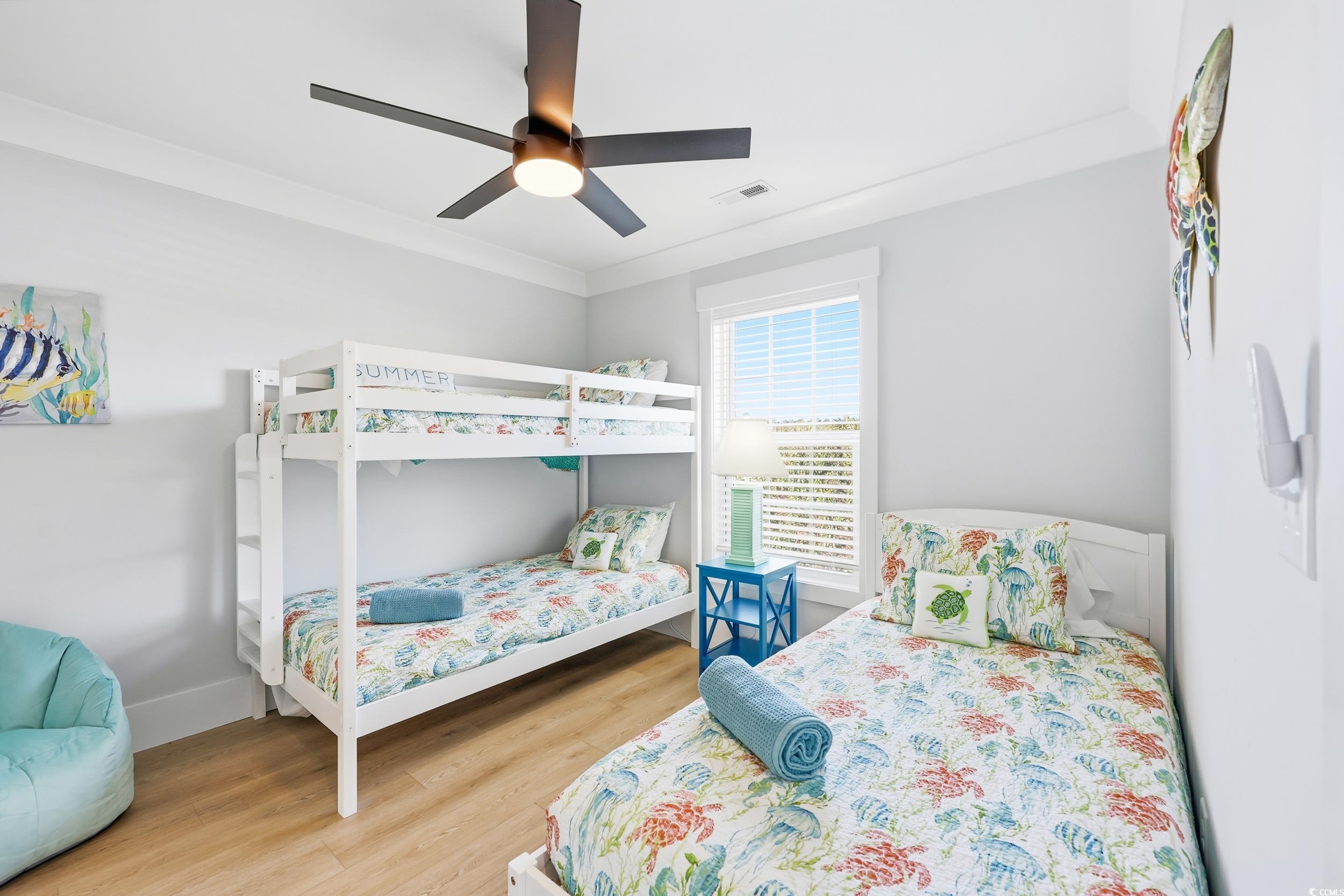 Bedroom featuring light wood-style flooring and ceiling fan