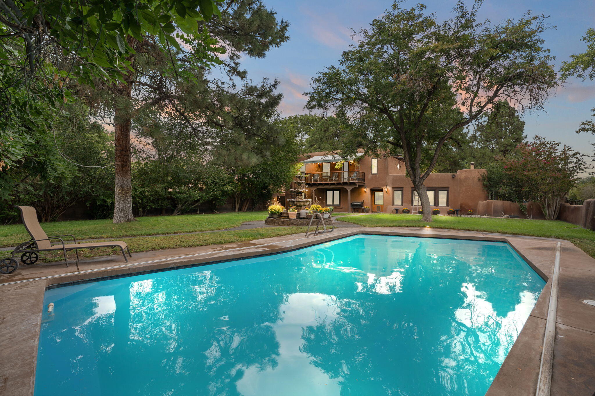 Experience this rare estate in the highly desirable Bosque Del Acres community! This stunning hacienda/adobe-style property offers top-tier equestrian amenities, exceptional privacy, an in-ground heated pool, a guest home, and more. The main residence features 3 bedrooms, 2 bathrooms, spacious living areas, updated kitchen appliances, and a refreshed primary bath. The guest home provides a 1 bedroom, 1 bathroom floor plan with an updated kitchen perfect for guests. Designed for both comfort and function, the estate includes open space for horses to train, 4 horse stalls with room to expand, a detached 3 car finished garage, and an outdoor kitchen perfect for entertaining. Serene landscaping, and equestrian-ready facilities, this Bosque Del Acres retreat is truly one of a kind.