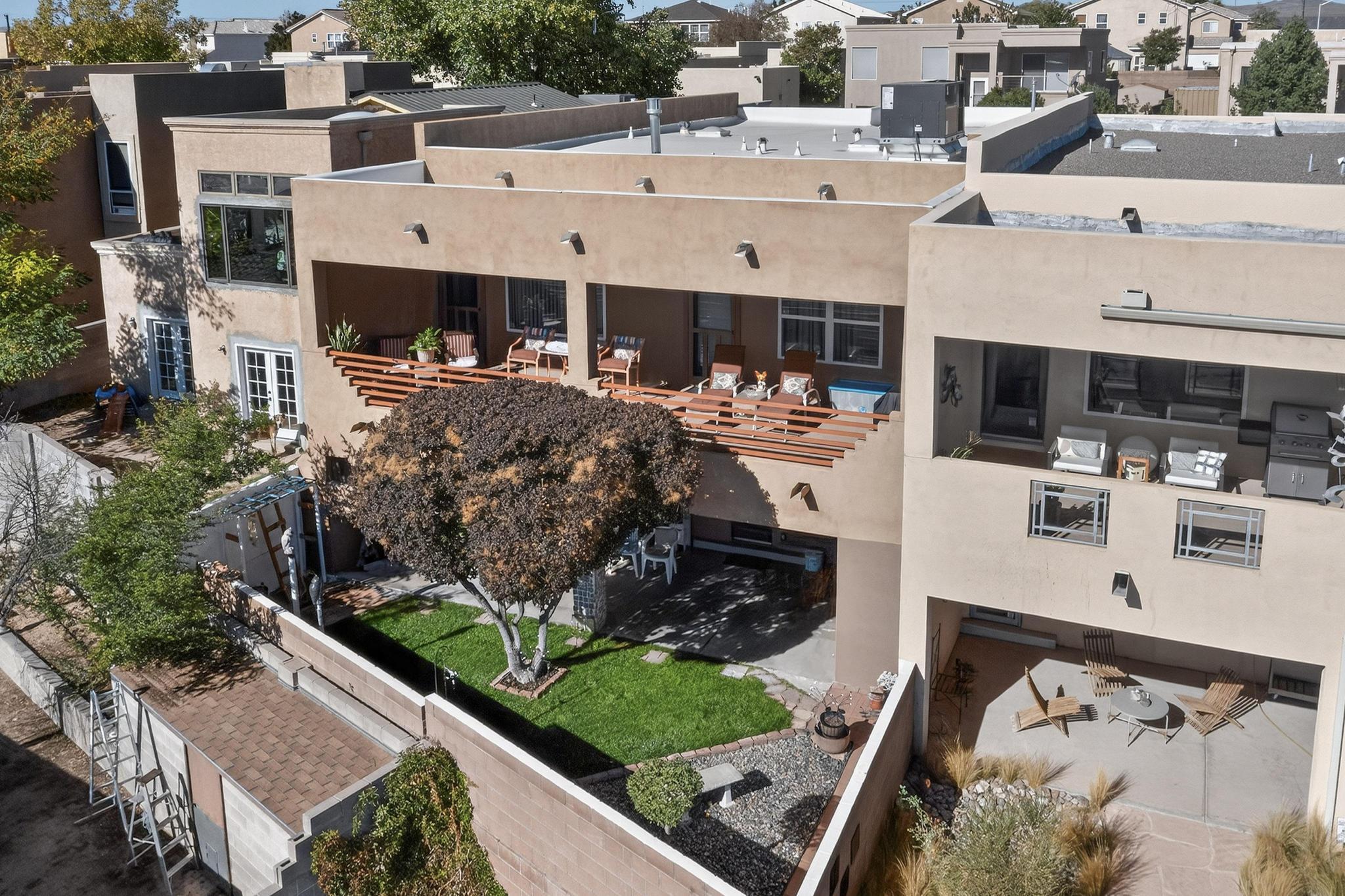 Check out the AMAZING VIEWS from this beautiful home!  Plenty of space, & a wonderful floor plan for a multi-gen/roommate or someone that likes extra space. NO HOA! Walk thru the library & step into the gourmet kitchen. Beautiful granite countertops, abundant cabinetry, & newer appliances create a welcoming space for friends/family. The kitchen opens into the living room & then out to the view deck. The primary suite, on the main floor, opens to the view deck also. Imagine grabbing your morning coffee & heading out to check out the sunrise over the Sandias Mountains. What a delightful place to live!  Downstairs you will find 2 bedrooms, a bath & a huge multi-purpose/family room/office/media room. There is also a yard & a second view deck. This property that has been loved; & it shows! WOW