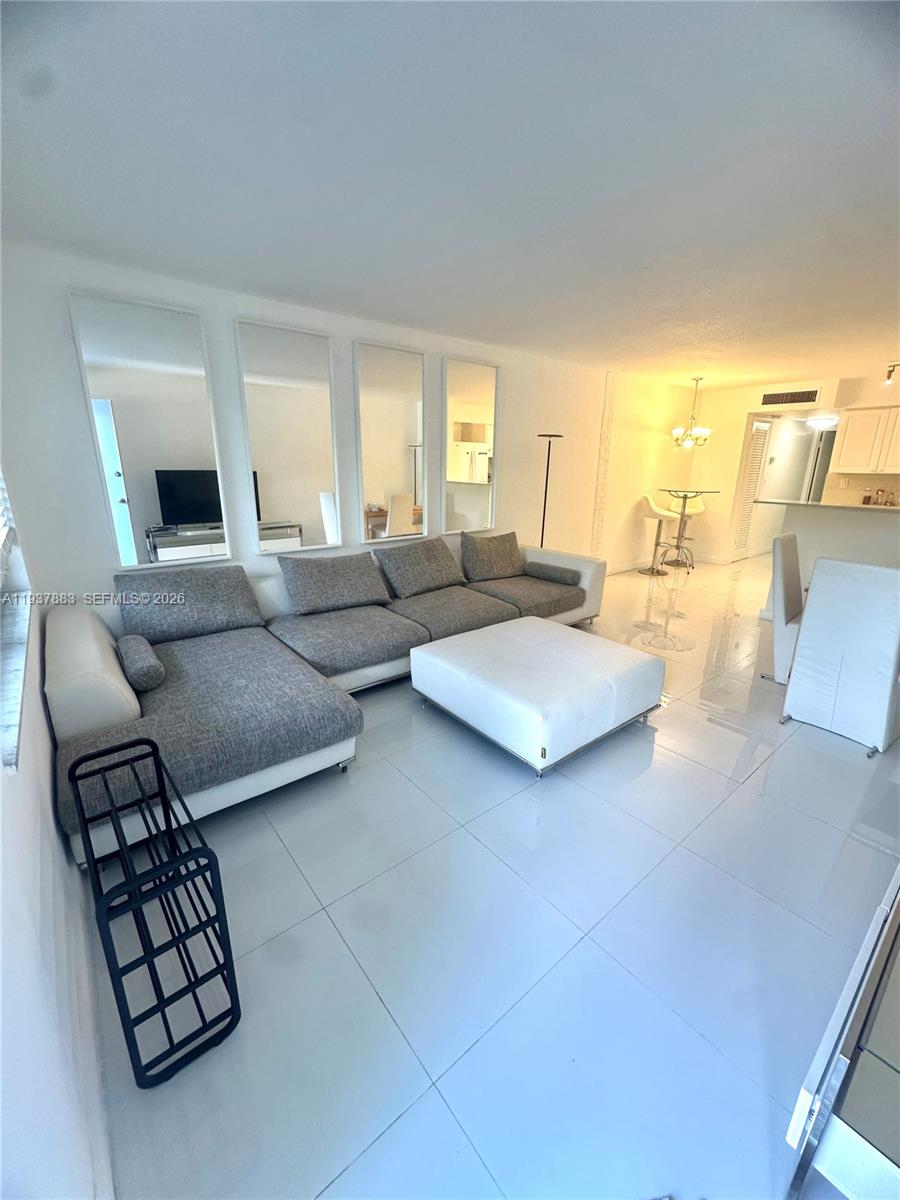 Open-concept living area at 1120 102nd St - Condo in Bay Harbor Islands