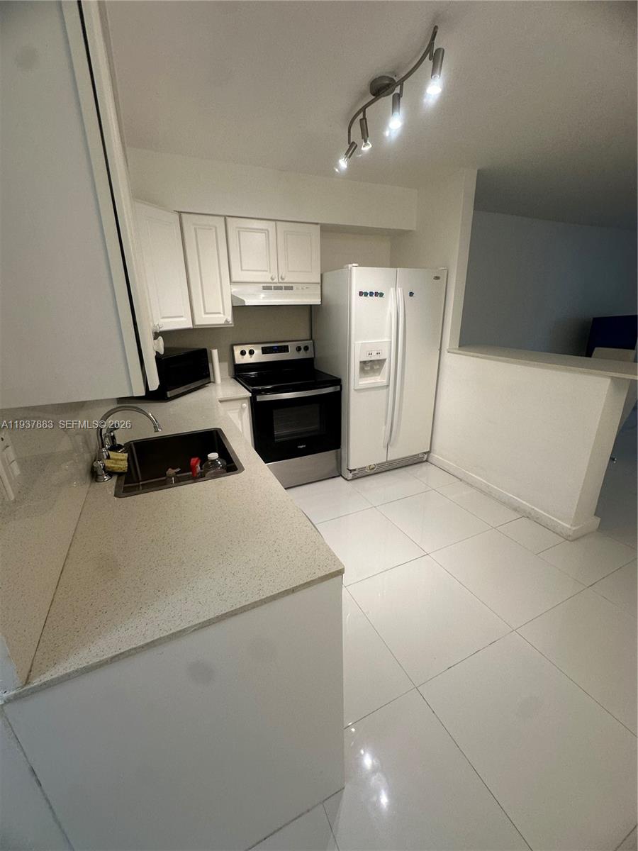 Modern kitchen with designer features at 1120 102nd St - Condo in Bay Harbor Islands