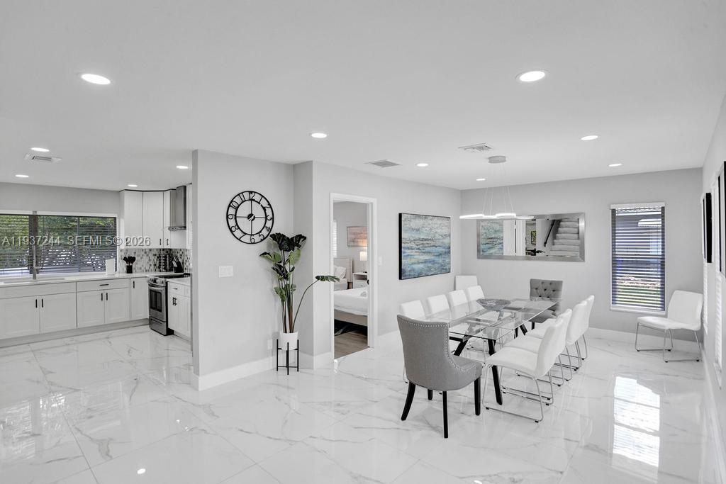 Exquisitely renovated two-story residence offering 6 bedrooms and 3 beautifully appointed bathrooms, situated on an expansive 12,000-square-foot lot in the highly desirable and private Little Harbor neighborhood of Deerfield Beach. This exceptional home features stainless steel appliances, spa-inspired marble bathrooms, and a luxurious jacuzzi. Outdoor living is elevated with a brand-new resort-style pool and an oversized deck ideal for entertaining. Enjoy tranquil water views from the second floor and the convenience of being just one mile from the beach. Completely move-in ready—an extraordinary opportunity to own a turnkey coastal retreat.