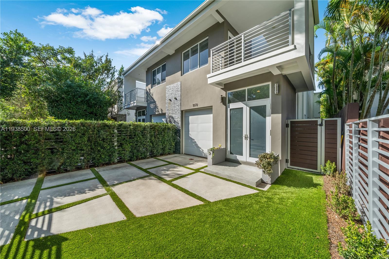 Sophisticated modern luxury on a quiet street, just steps from the heart of Downtown Coconut Grove. This beautifully designed residence features four spacious bedrooms and four full bathrooms, complemented by soaring ceilings and abundant natural light. The open-concept layout showcases a designer kitchen with gas cooktop, oversized island with snack counter, and sleek finishes throughout. Tile flooring runs seamlessly through the home.Enjoy true indoor-outdoor living with a private pool in a secluded setting, complete with covered patio and convenient access to a cabana bath. The expansive primary suite offers a large walk-in closet and a spa-inspired bath with dual sinks. Additional highlights include two private balconies, a one-car garage plus gated parking, and no maintenance fees—an exceptional opportunity for luxury living in one of Coconut Grove’s most desirable locations.No mostly maintenance fee. Two units share the cost of master insurance.