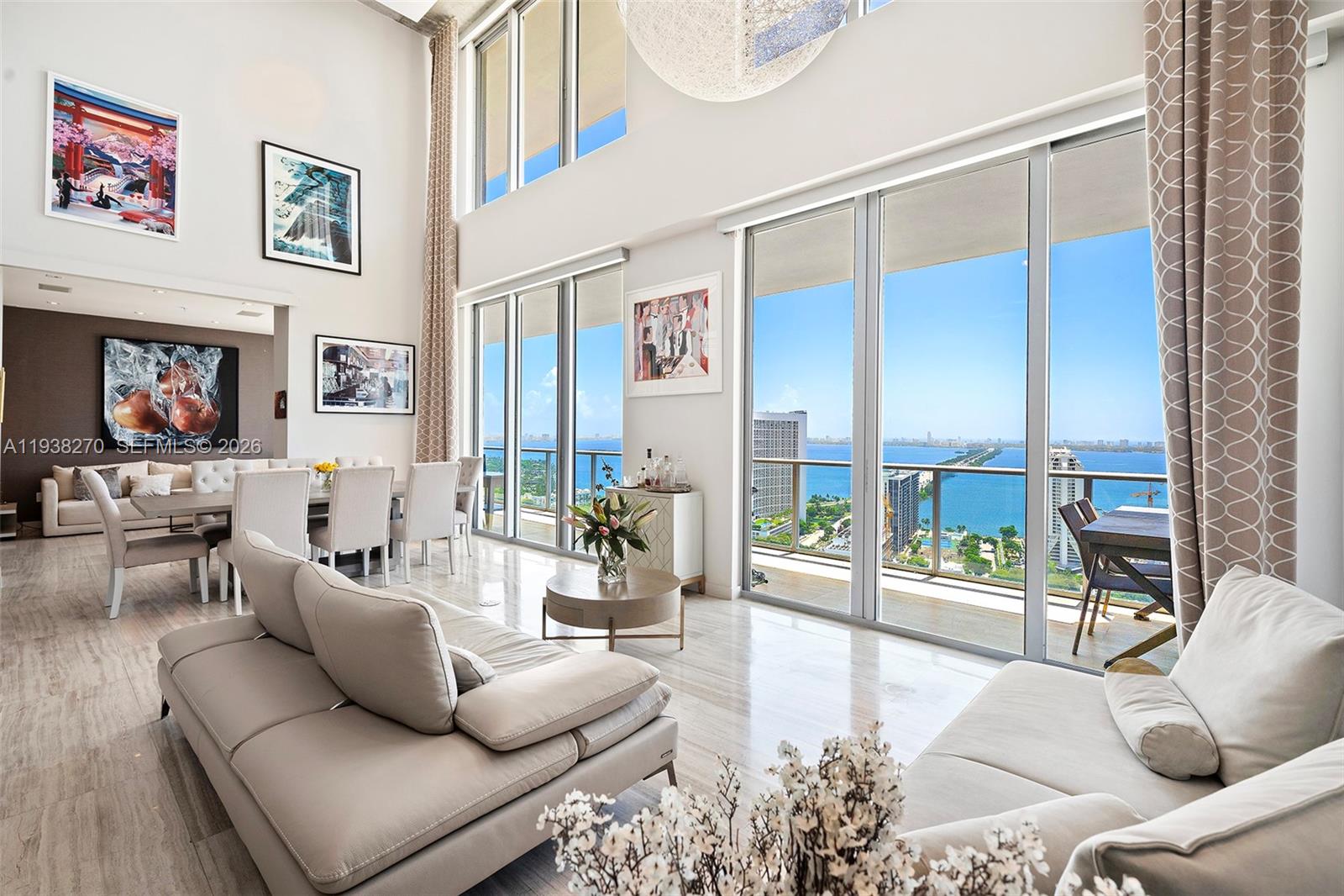 Penthouse 207 is a two-story residence offering expansive interior volume and architectural presence in a prime Midtown Miami location. This light-filled home features high ceilings, a flow-through open living area, Tuscan marble flooring throughout, and high-quality luxury finishes. A custom Italian kitchen integrates seamlessly with the main living space, reinforcing the open, design-forward layout ideal for entertaining. The residence offers flexibility and privacy across multiple levels. Residents enjoy access to a full suite of amenities including pool, spa facilities, and recreation areas. Ideally positioned steps from the Design District and minutes from Wynwood, Midtown, and Miami Beach, with dining, shopping, and cultural destinations all within close reach. Easy to show call or text
