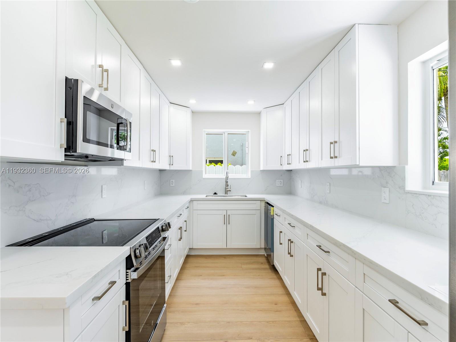 Open-concept living area at 254 4th St - Home in Dania Beach