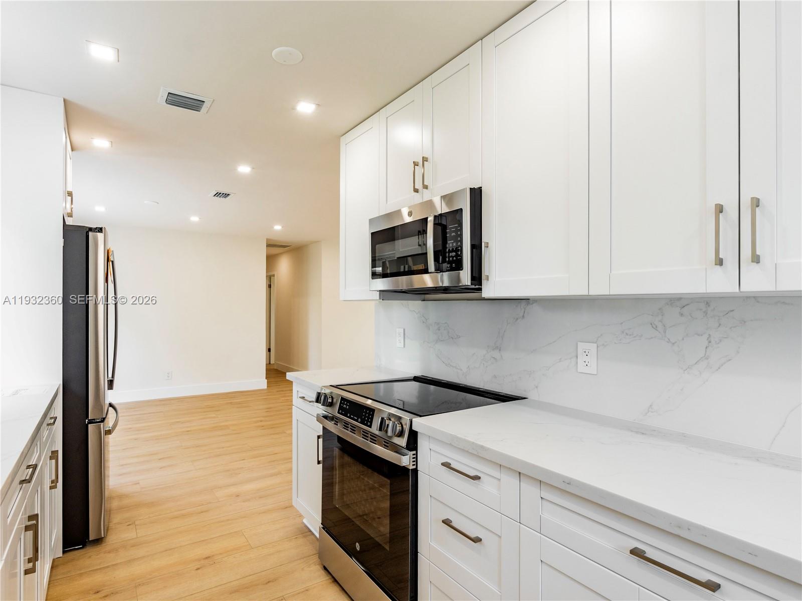 Elegant master bedroom retreat at 254 4th St - Home in Dania Beach