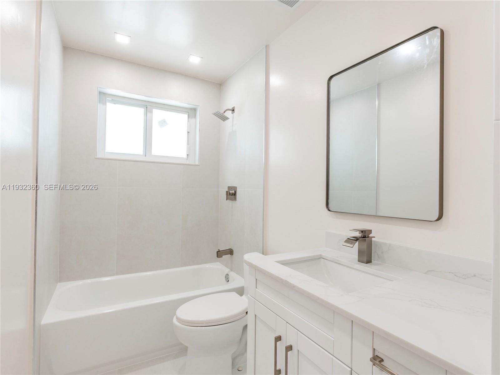 Well-appointed guest bedroom at 254 4th St - Home in Dania Beach