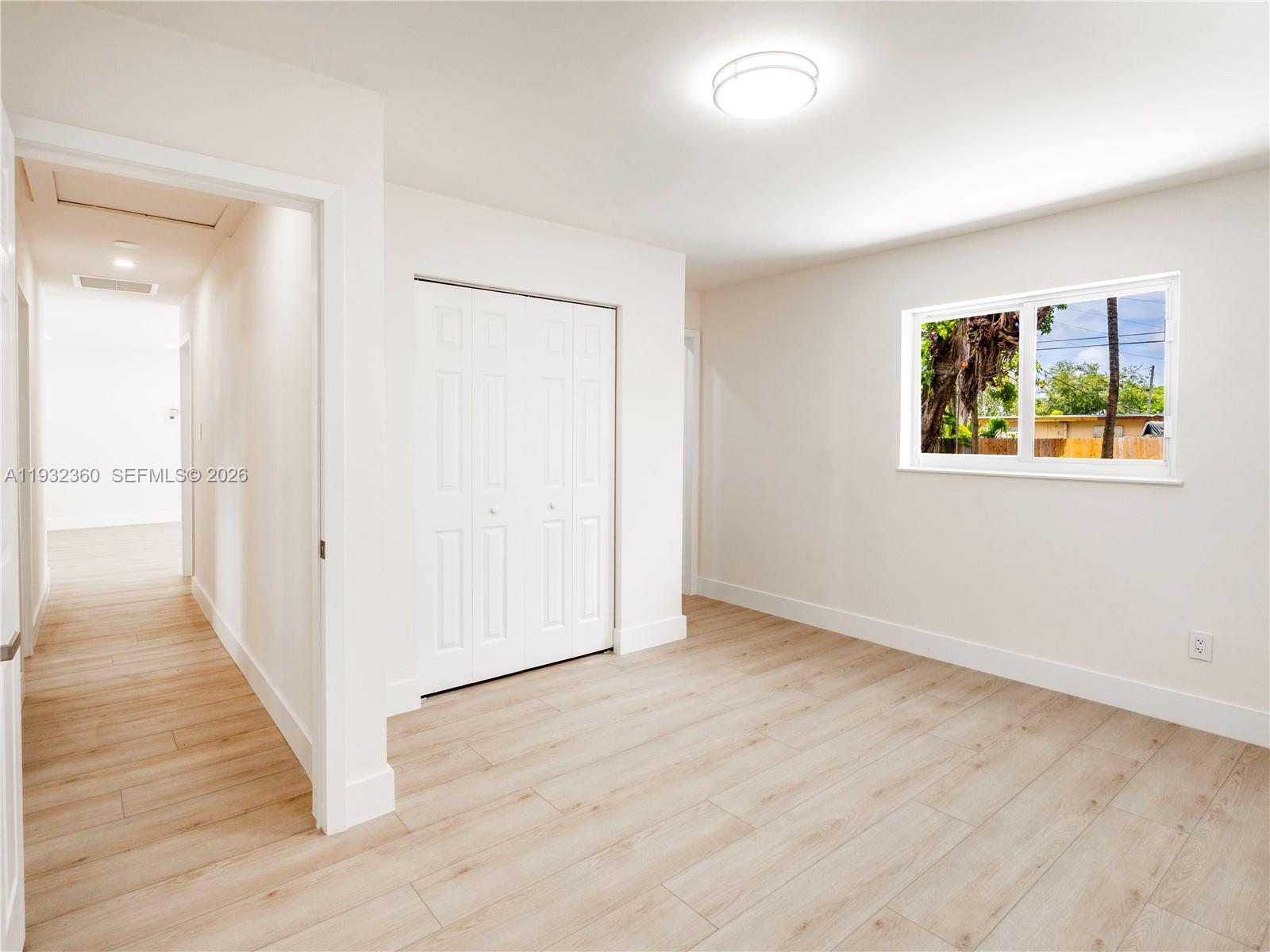 Open-concept living area at 254 4th St - Home in Dania Beach