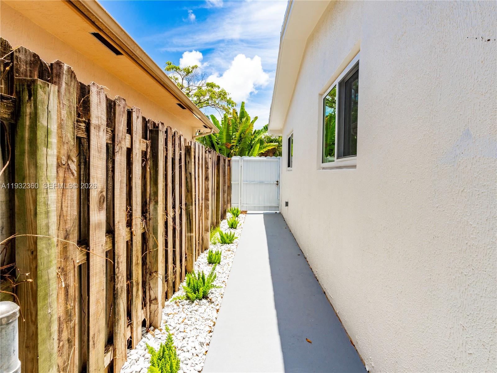 Open-concept living area at 254 4th St - Home in Dania Beach