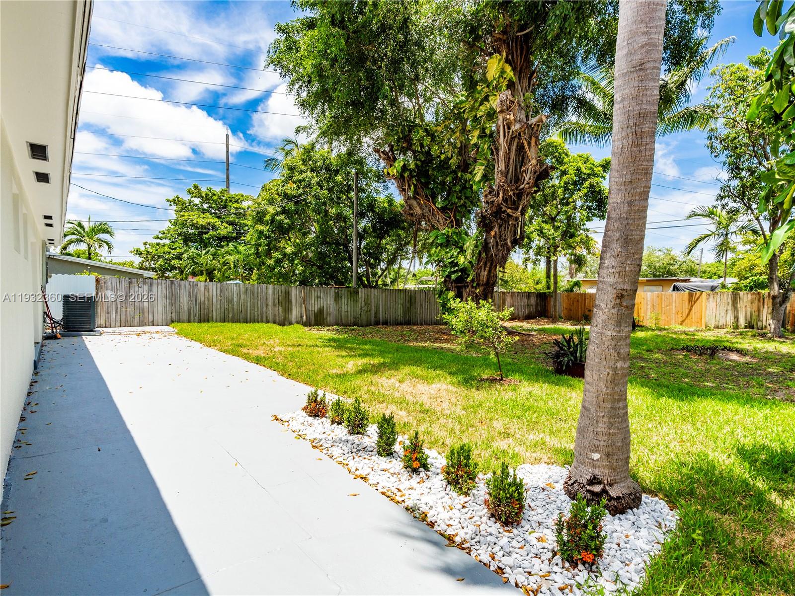 Modern kitchen with designer features at 254 4th St - Home in Dania Beach