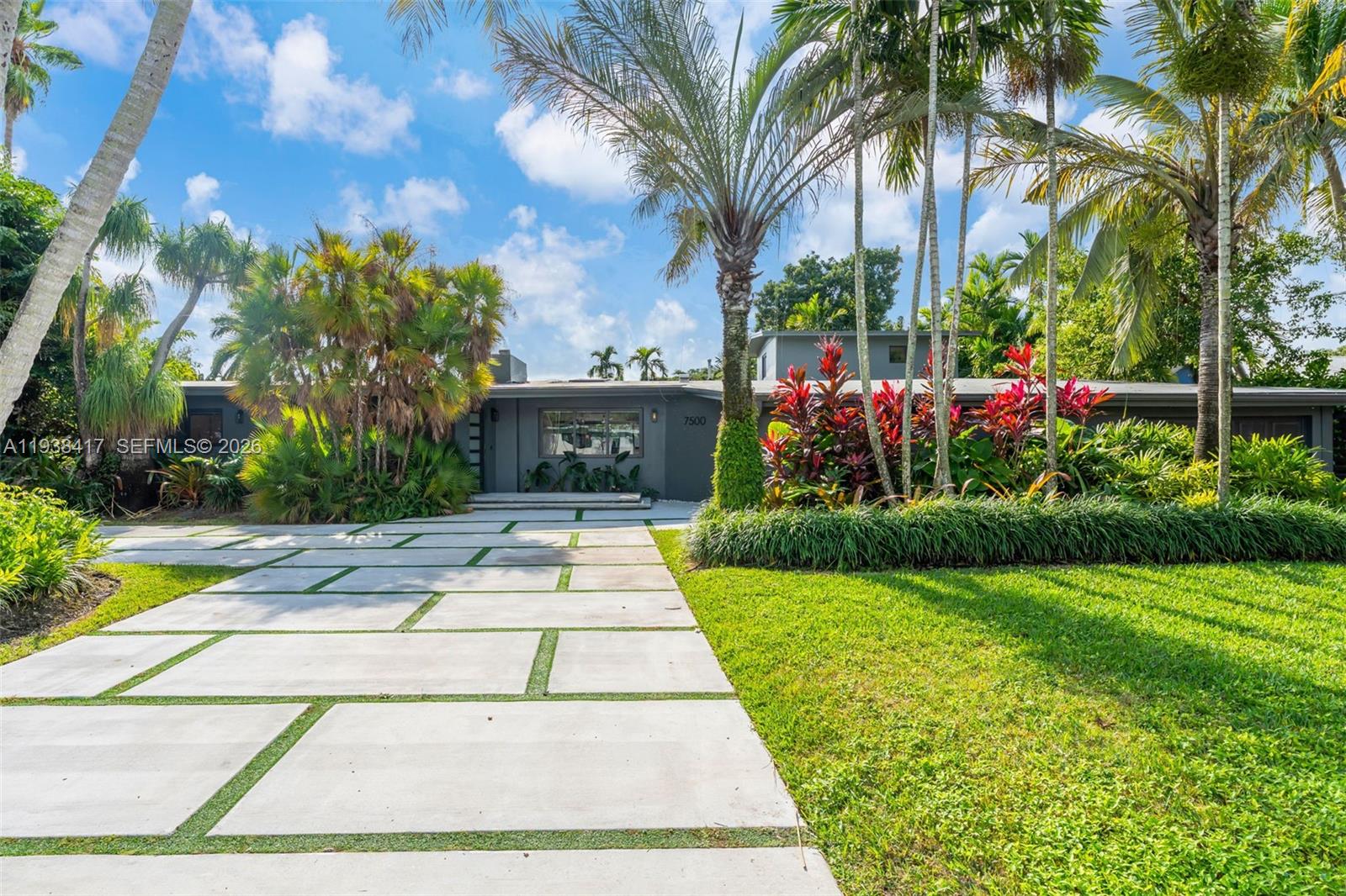 Discover the pinnacle of contemporary luxury in this meticulously remodeled 5-bedroom, 4.5-bathroom estate, perfectly positioned within a prestigious, walkable Palmetto Bay enclave renowned for its top-tier schools. This architectural gem has been reimagined with high-end finishes and an open-concept design, featuring a dedicated executive home office tailored for the sophisticated professional and expansive living areas that flow seamlessly toward a chef-inspired kitchen. Every detail prioritizes both security and comfort, from the full suite of updated hurricane-impact windows to the grand primary sanctuary and secluded guest quarters that offer an unparalleled level of privacy for visitors. Outside, the property transforms into a private resort-style retreat, centered around a shimmering pool and manicured grounds designed for world-class entertaining and serene relaxation.