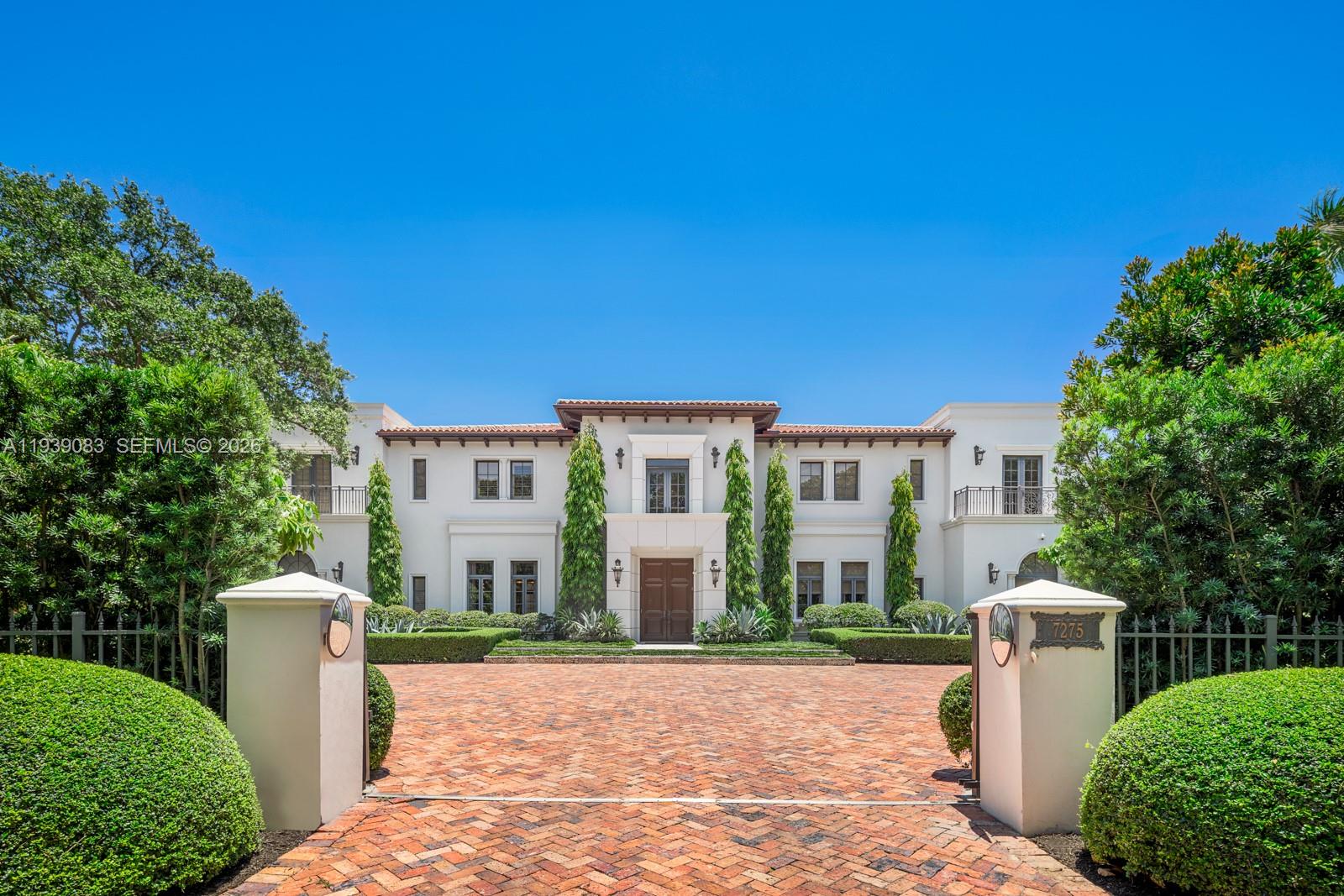 Iconic Old Cutler Road estate in the highly sought after South Coral Gables neighborhood. Blending classic architecture with contemporary design, every detail has been carefully curated to create a one of a kind living experience.This 7BD/7BA/2HB residence sits behind a gated driveway with mature landscaping offering exceptional privacy. A grand 2-story entry opens to formal living and dining rooms, family room, gourmet chef’s kitchen w/built in breakfast room, wine cellar, office, and elevator.The second level features a stunning primary suite with sitting area, spa like dual baths, custom closets, 3 add’l bedrooms and balconies overlooking the manicured grounds.Outdoor oasis with pool, basketball court, summer kitchen, and multiple entertaining areas, perfect for entertaining.Elegant and timeless