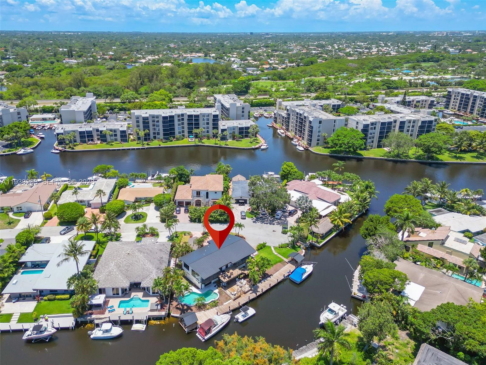 Live the ultimate South Florida waterfront lifestyle in this beautifully remodeled 5-bedroom, 4.5-bath pool home. Has a unique Split floor plan with upstairs featuring a 3 Bed/ 2.5 Bath and two guest units downstairs. Featuring an impressive 180-foot private dock, perfect for multiple boats and water toys, this property is a boater’s dream.Highlights include a new roof, impact windows, upgraded deck, and high-end finishes throughout. The upstairs primary suite offers a private balcony, walk-in closet, and spa-style bath, while the downstairs guest suite and extra living space are ideal for entertaining. Also, Great for investors looking to invest in an Airbnb.Minutes from Deerfield Beach, the pier, parks, shopping, and dining, this is luxury coastal living at its best. Don’t miss this rare waterfront opportunity.
