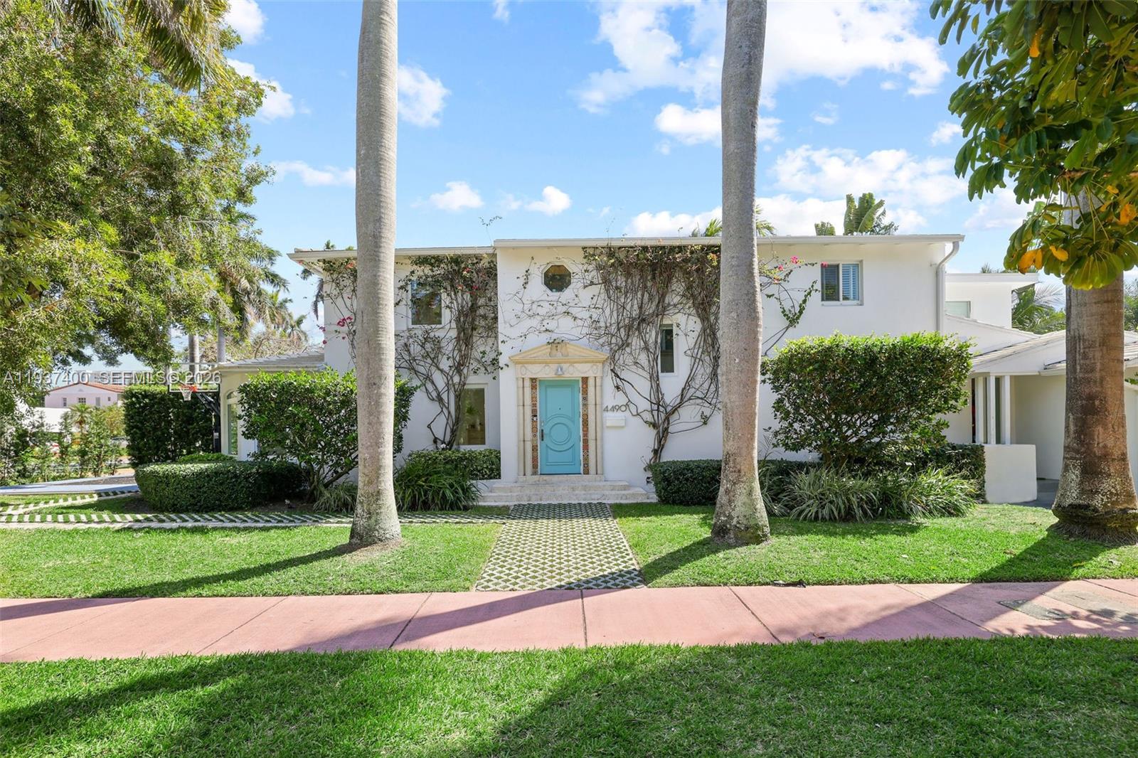 Experience the best of Miami Beach living in this Art Deco corner lot residence. Thoughtfully renovated to preserve its original charm, this two story home features a brand new roof completed in 2025, a grand marble fireplace, and beautifully restored original wood floors throughout. The thoughtfully designed floor plan offers three bedrooms upstairs, including the primary suite, along with two bathrooms. The main level includes an additional bedroom with an en suite bathroom, ideal for guests or multigenerational living. The spacious kitchen blends classic character with modern convenience and offers sleek cabinetry, stainless steel appliances, and a built in wine fridge, making it ideal for both everyday living and entertaining.Outdoors, enjoy an expansive pool and yard area complemented by a private basketball court. An additional office or flex space, accessible via exterior stairs, provides a versatile setting for a home office or gym. Set on a picturesque tree lined street just minutes from 41st Street shopping, the beach, and with easy access to the Design District, Downtown Miami, and Miami International Airport, this home offers a rare combination of charm, space, and location.