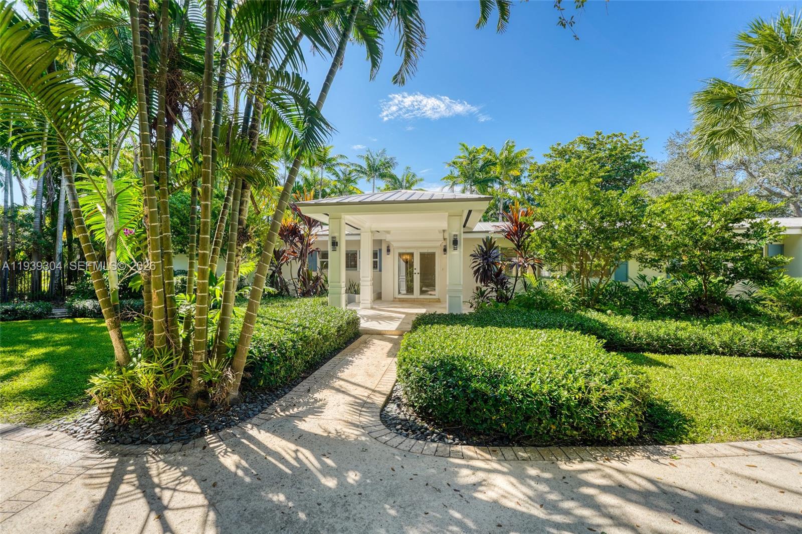 Timeless Pinecrest! Secluded lake estate in prime North Pinecrest surrounded by Multi-Million dollar homes. This one Acre Pool home is minutes from Pinecrest Elementary and Pinecrest Recreational Center. The property is completely gated for ultimate privacy. This 5 Bed 4.5 Bath has a Triple split bedroom layout that allows for maximum privacy, including the ability to have two master bedrooms, The family room's massive window wall allows for a picturesque Landscape with views of your own private lake. Enjoy the huge formal living room which overlooks the pool and spa. 2 Brand new HVAC units, Large pantry. Lots of light throughout. Whole home generator. This home has so much to offer. Call the listing agent