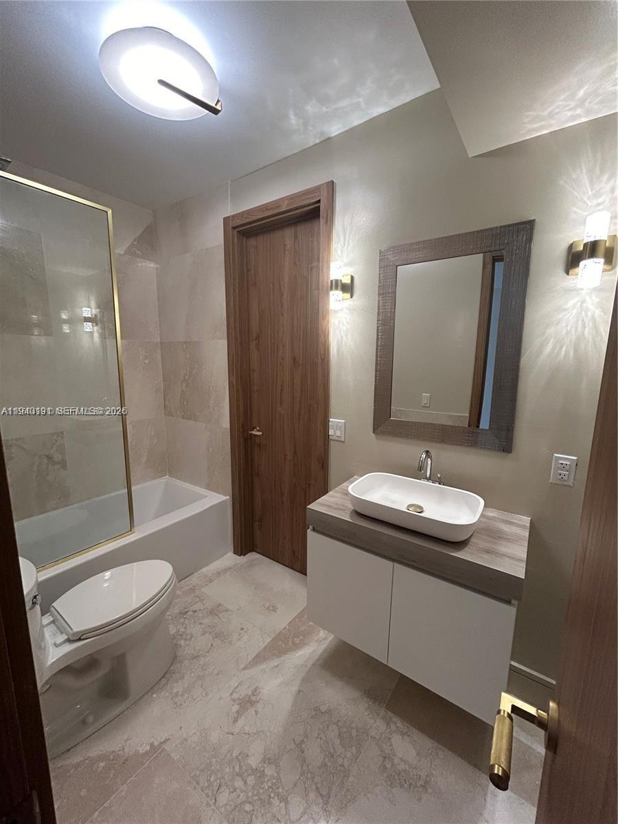 Open-concept living area at 1060 92nd - Condo in Bay Harbor Islands