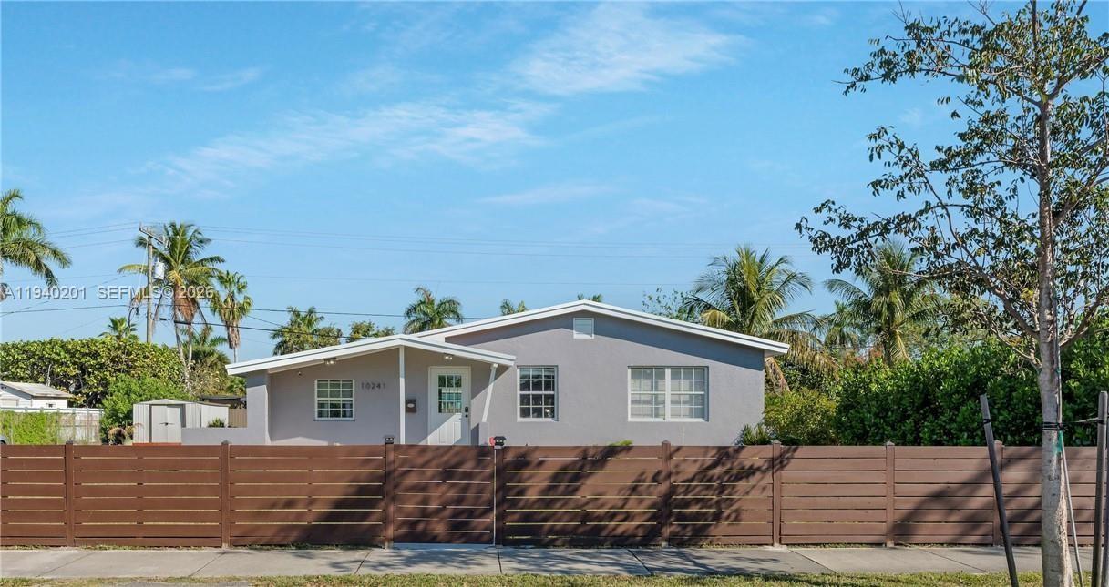 Welcome to this charming 3-bedroom, 2-bathroom home located in the heart of Cutler Bay. Featuring upgraded modern flooring throughout and a beautifully renovated kitchen with quartz countertops and stainless steel appliances, this home offers a perfect blend of style and functionality. Enjoy an oversized backyard with plenty of room to add a pool ideal for entertaining or creating your own outdoor oasis. The newly installed patio roof provides the perfect shaded space for relaxing or hosting gatherings. Conveniently located near shopping, dining, parks, and major highways. This move-in-ready home is a must-see!